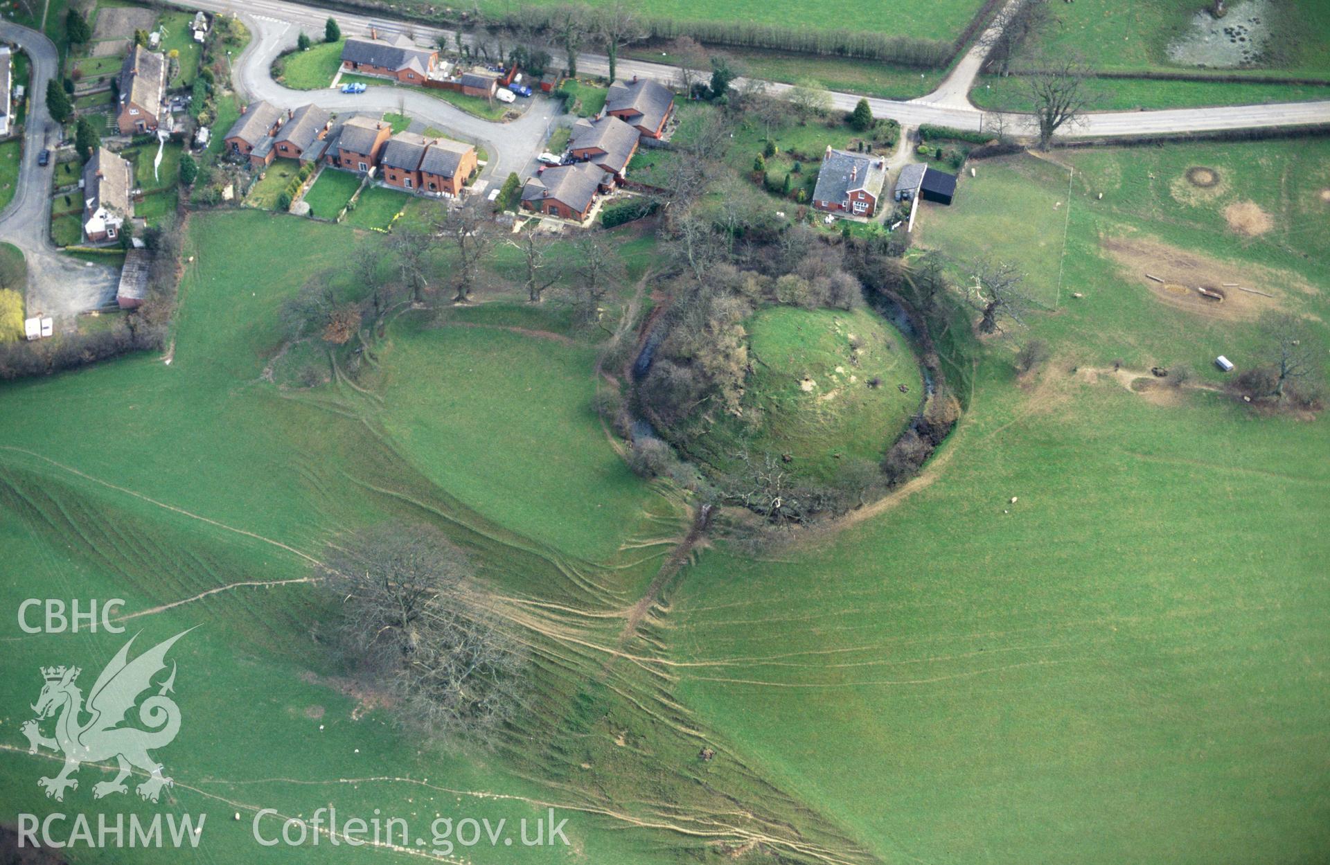 RCAHMW colour slide oblique aerial photograph of Domen Gastell, Llanfechain, taken by C.R.Musson on the 11/04/1996