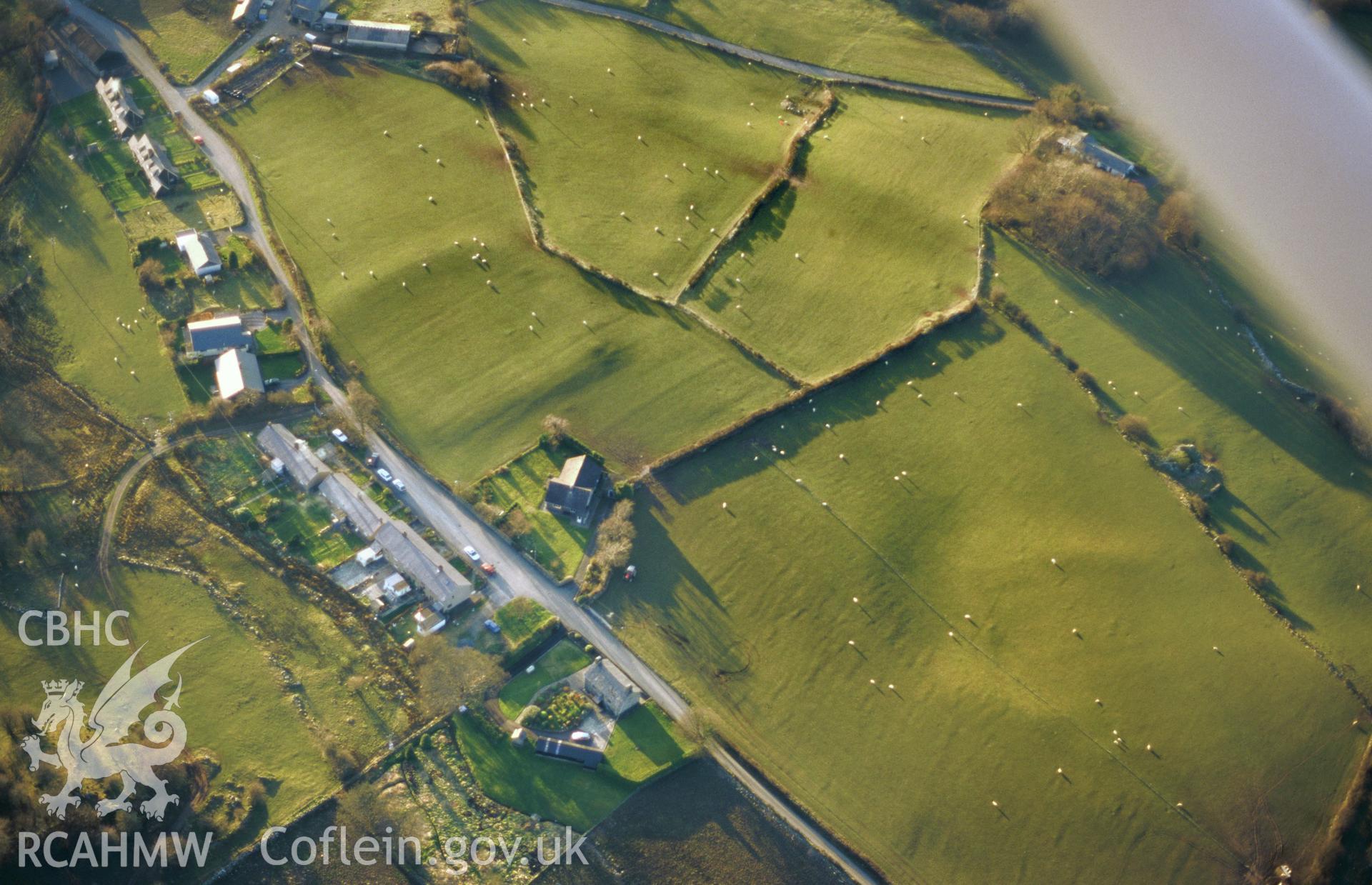 Slide of RCAHMW colour oblique aerial photograph of Brithdir Roman Fort, taken by T.G. Driver, 17/3/1999.