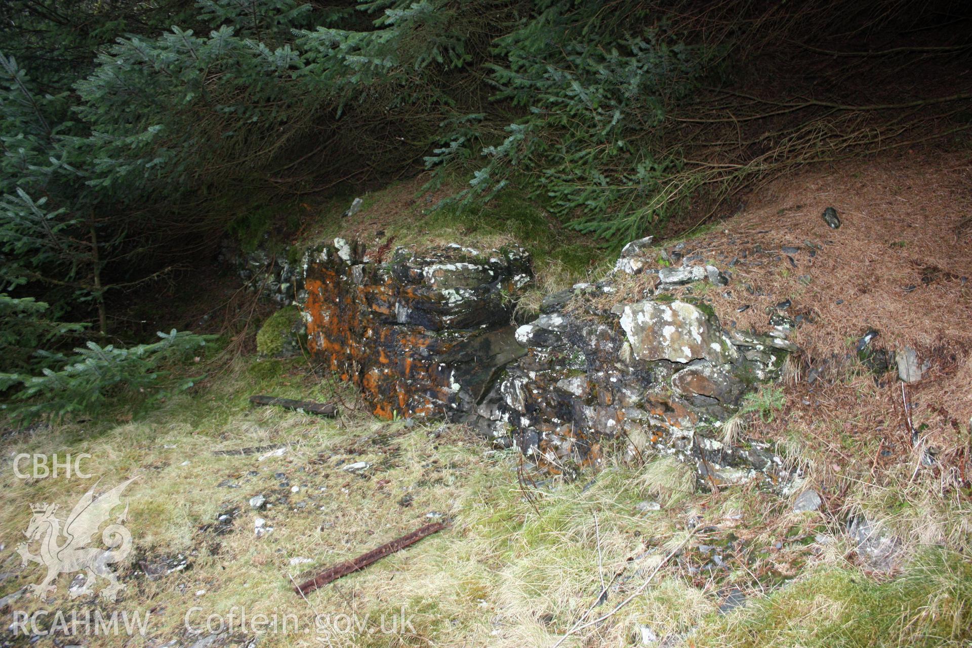 Ystrad Einion metal mine. Retaining wall behind which two stone faced ore bins were cut into the hillside.