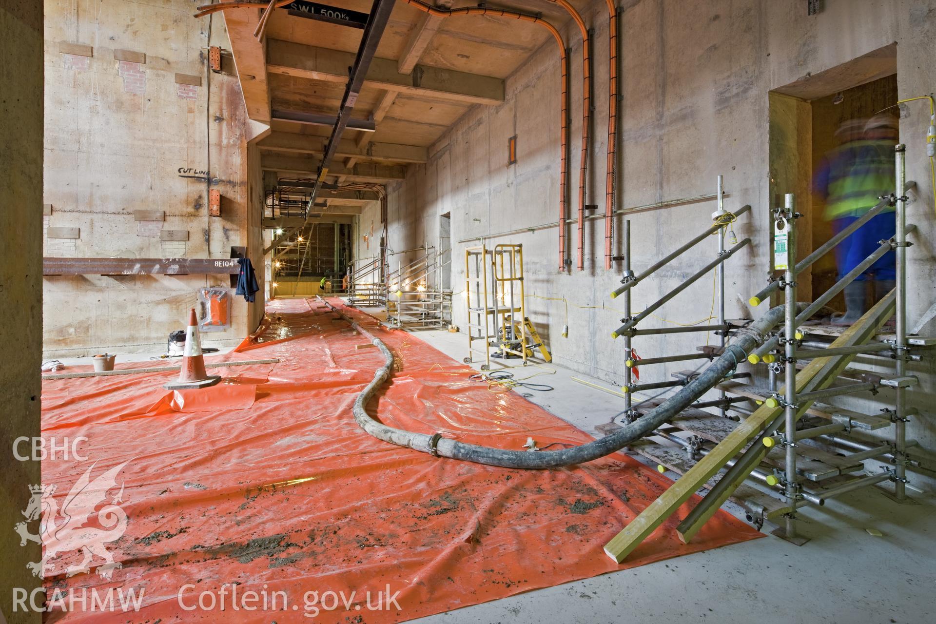 The concrete pump static line entering a hot gas duct cell, to form part of the roof slab.
