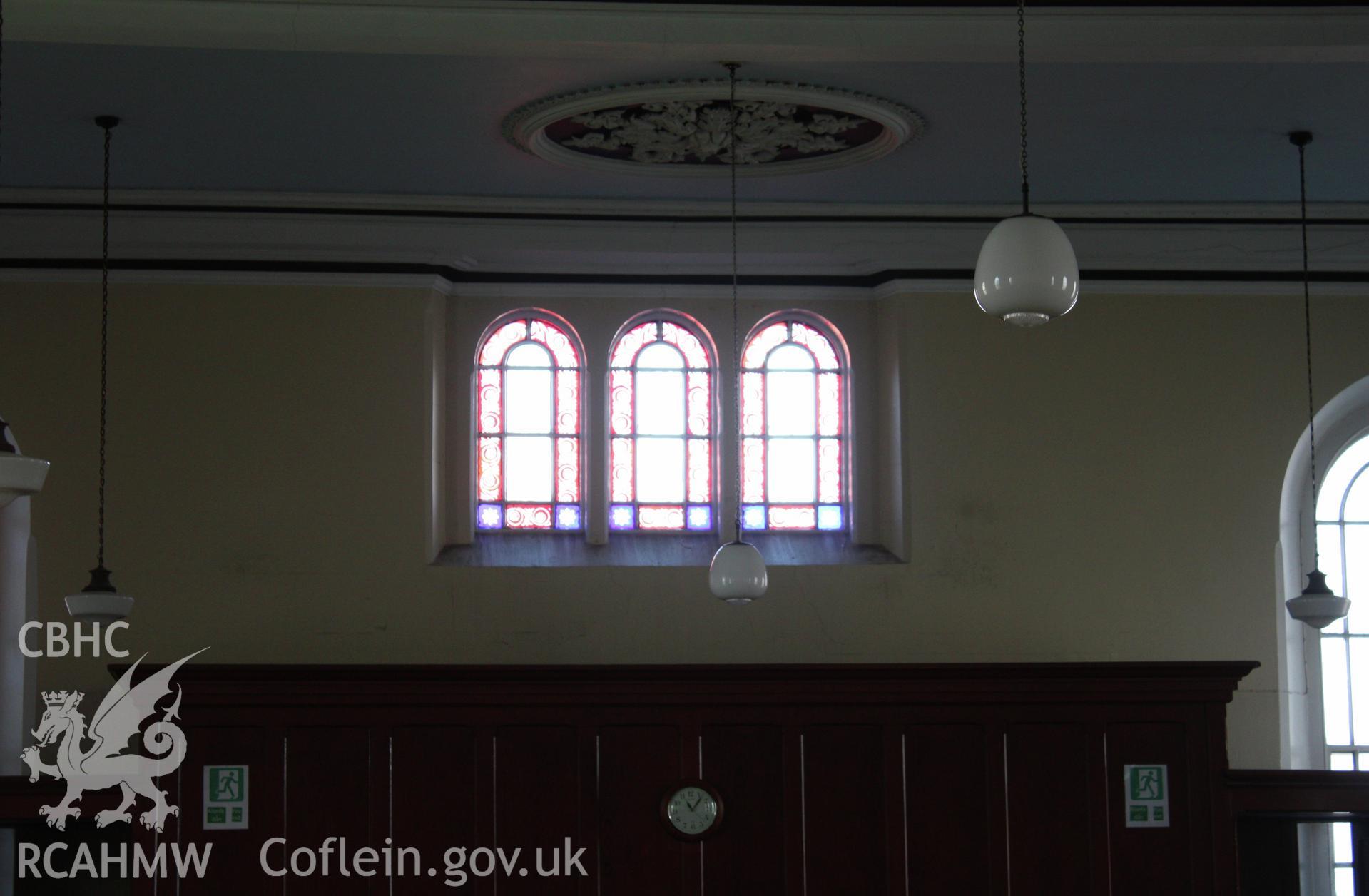 Interior, arched windows above entrance lobby