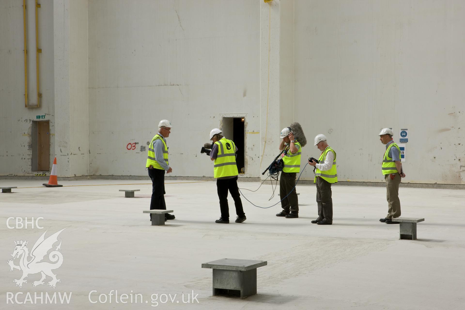 Film crew recording within reactor building