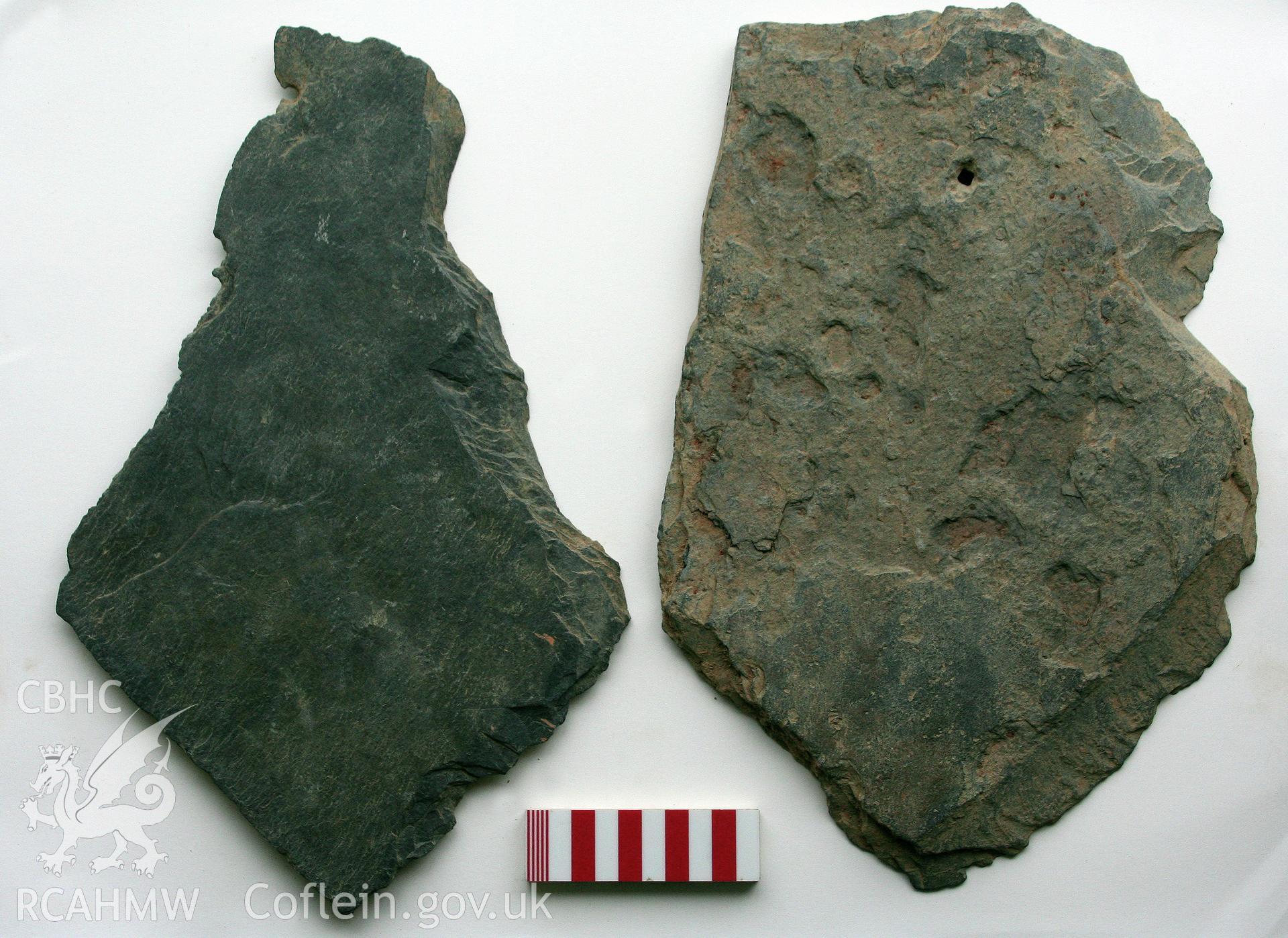 Abermagwr Roman villa excavations, July 2010. Two pentagonally-cut stone roofing tiles recovered from the site.