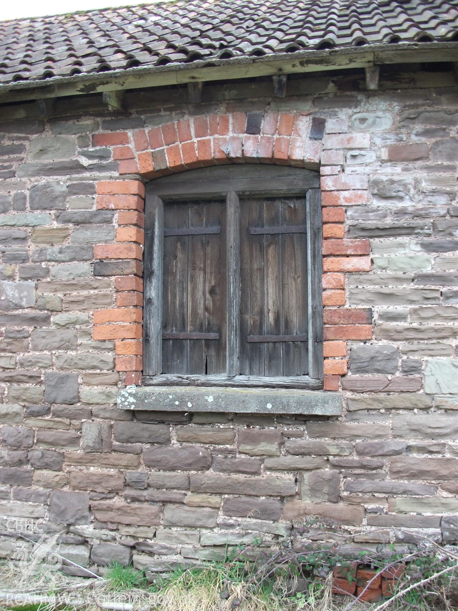 Colour digital photograph of exterior of barn - window; at Llangwm Isaf Farm, received in the course of Emergency Recording case ref no RCS2/1/1599.