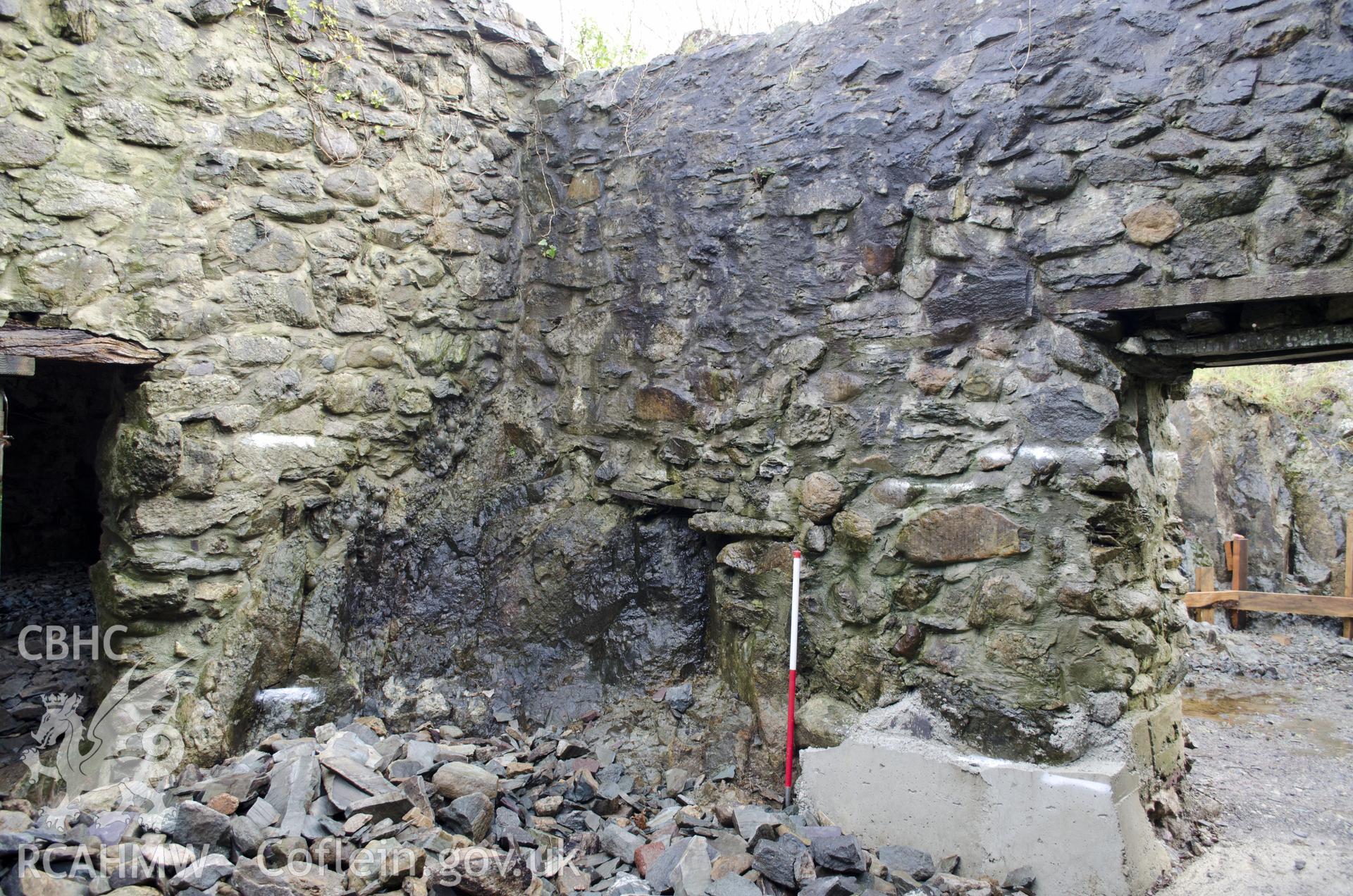 View from west showing bedrock built into the E corner of the SW room, taken by Jessica Davidson, Gwynedd Archaeological Trust, 8th Jan 2016.