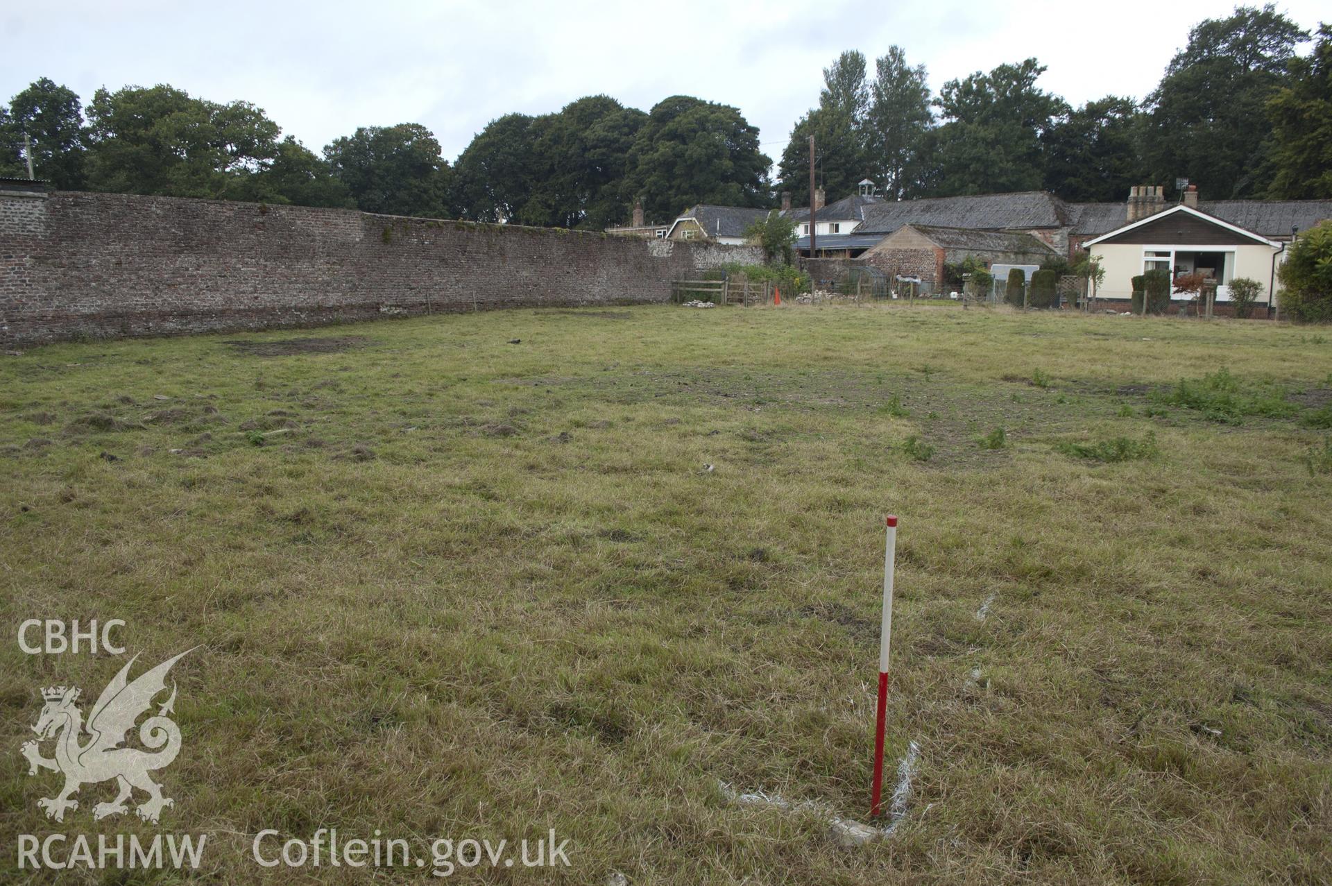 View from south-east showing pre-excavation view of tennis court,  kitchen garden.