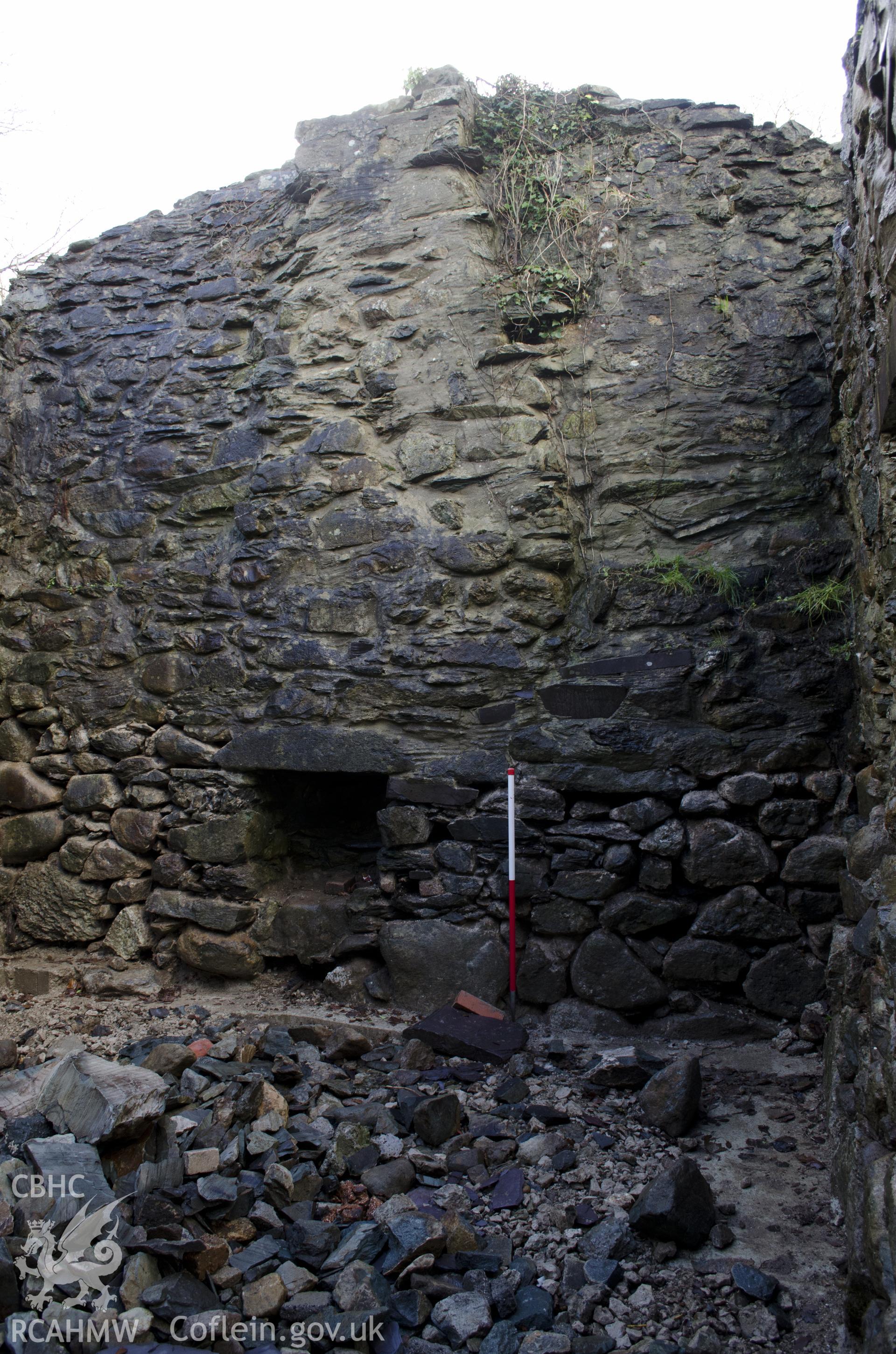 View from north showing fireplace in the SW gable wall in the SW room, taken by Jessica Davidson, Gwynedd Archaeological Trust, 8th Jan 2016.