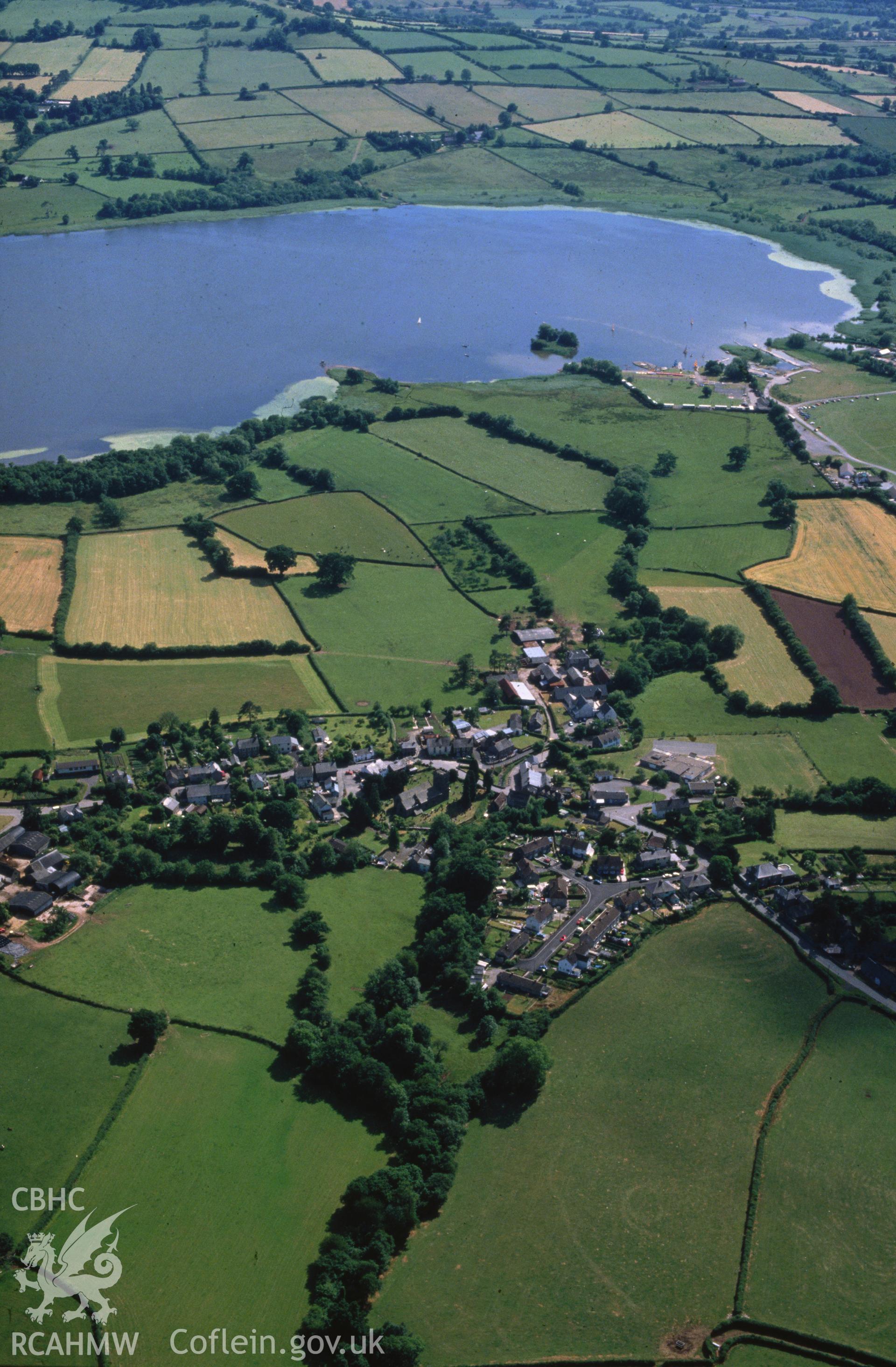 Slide of RCAHMW colour oblique aerial photograph of Llangorse, taken by C.R. Musson, 29/6/1989.