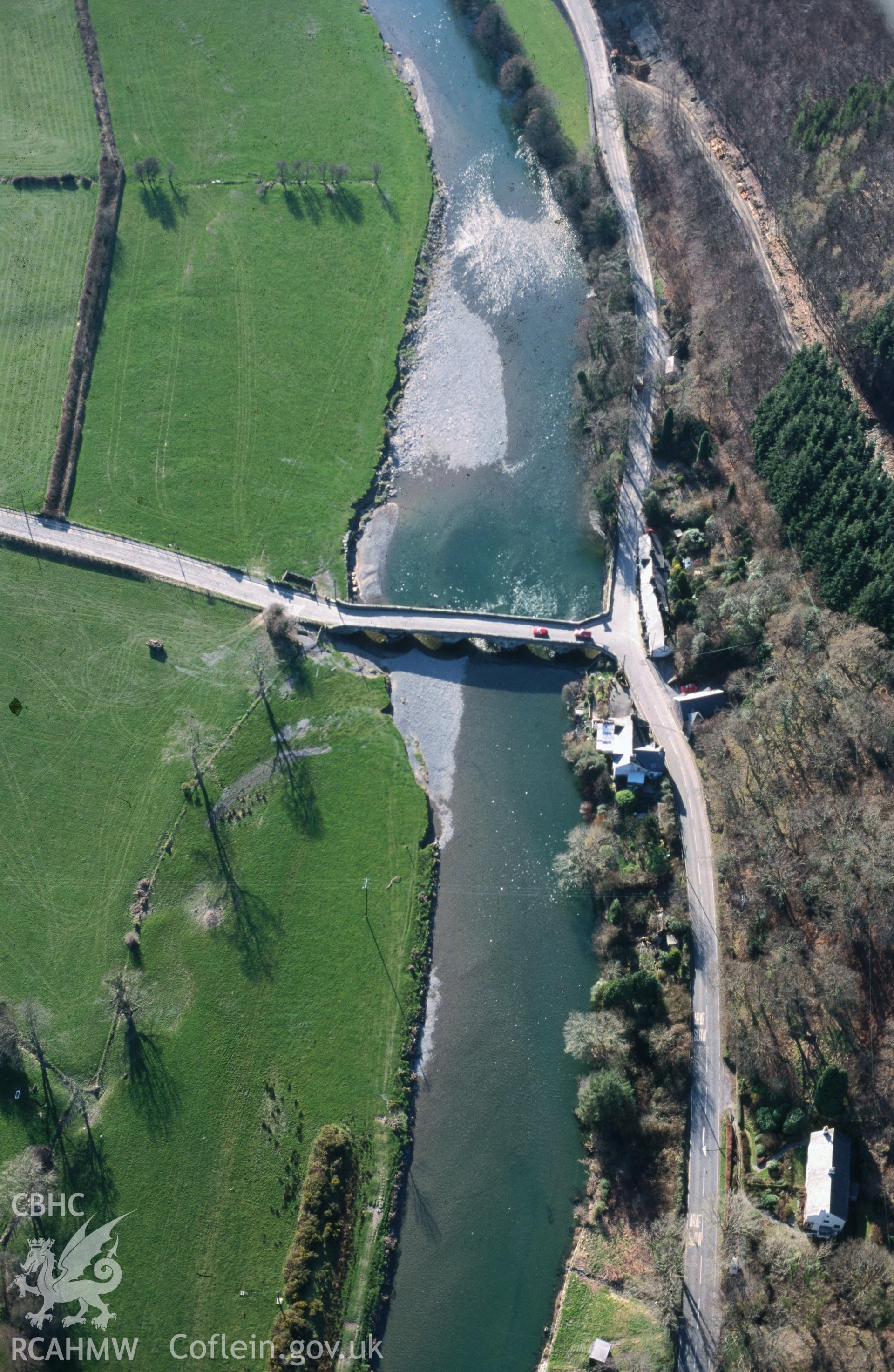 Slide of RCAHMW colour oblique aerial photograph of Machynlleth Bridge;pont Ar Ddyfi, taken by T.G. Driver, 17/3/1999.