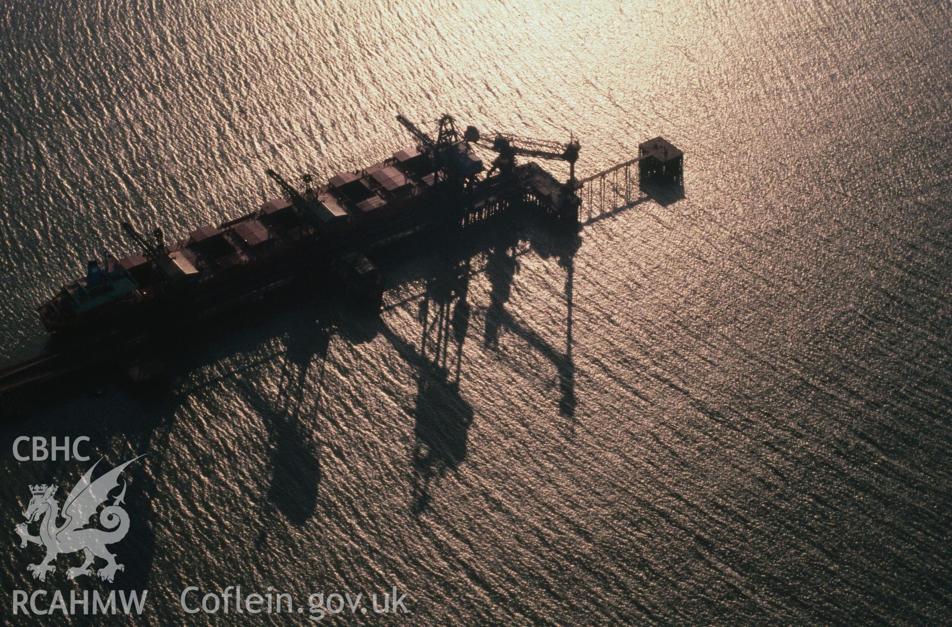 Slide of RCAHMW colour oblique aerial photograph of Port Talbot Docks, taken by C.R. Musson, 12/2/1988.