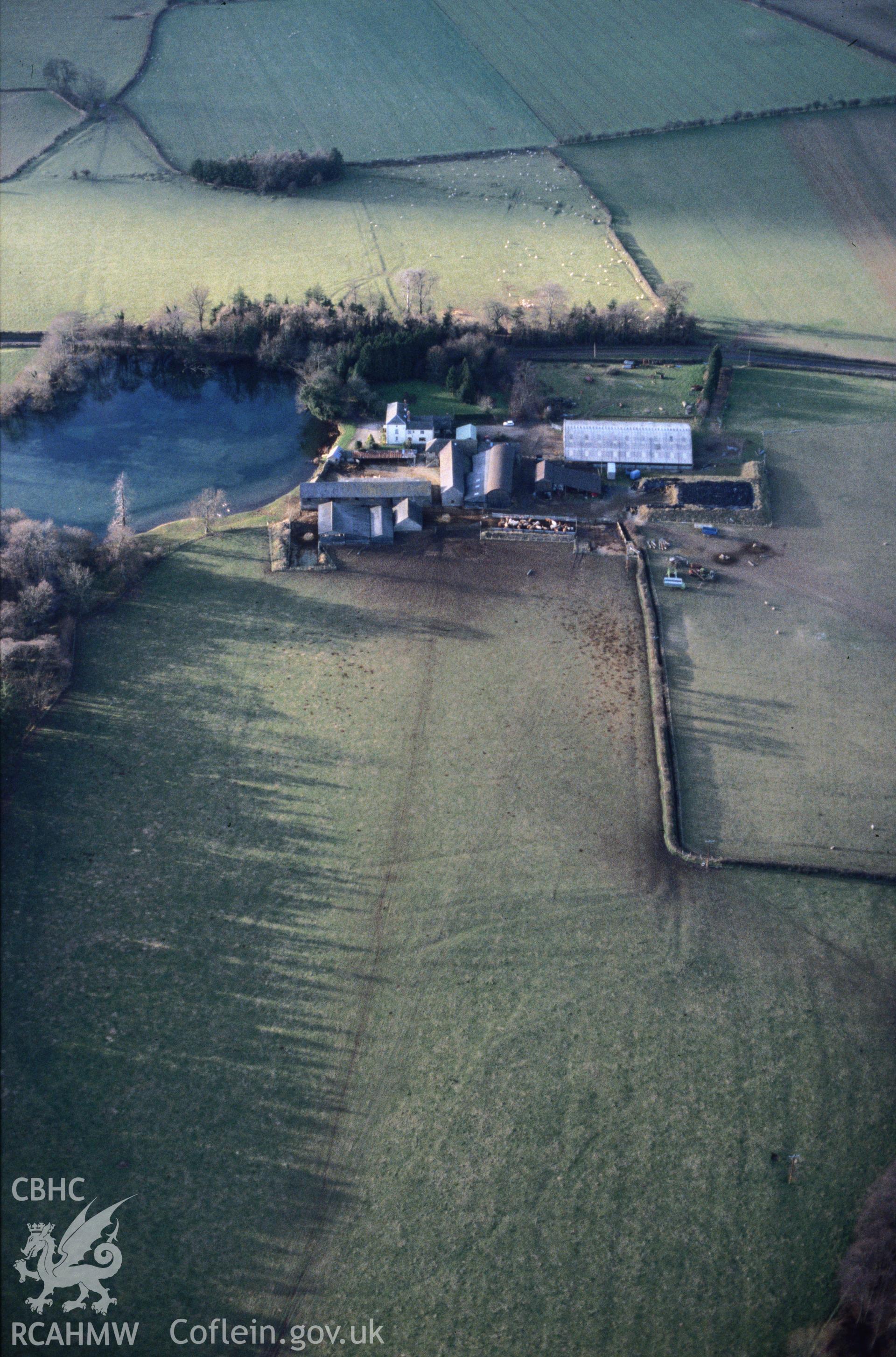 Slide of RCAHMW colour oblique aerial photograph of Hindwell Farm Fort, taken by C.R. Musson, 27/12/1996.