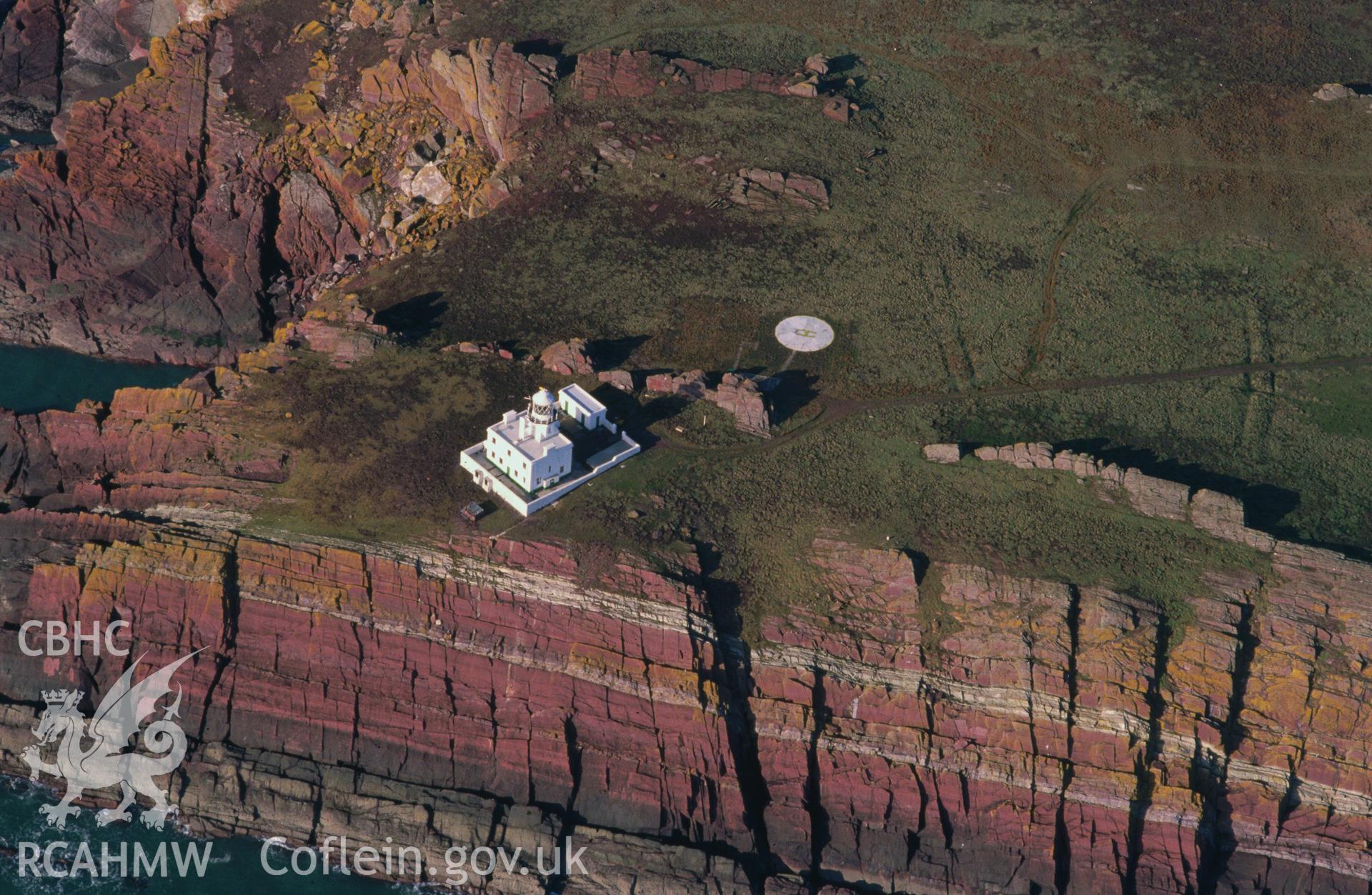 Slide of RCAHMW colour oblique aerial photograph of Skokholm Island Lighthouse, taken by C.R. Musson, 23/2/1993.