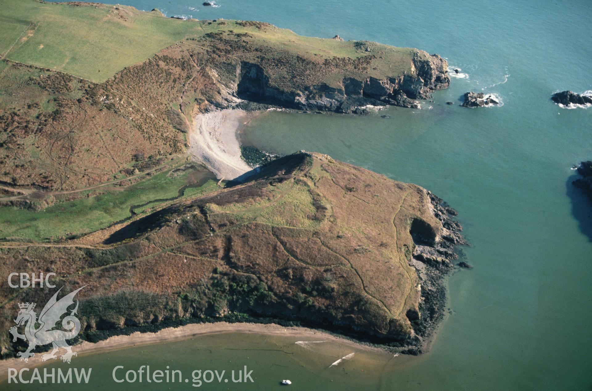 Slide of RCAHMW colour oblique aerial photograph of Promontory Fort S Of Solva Harbour, taken by C.R. Musson, 24/3/1991.