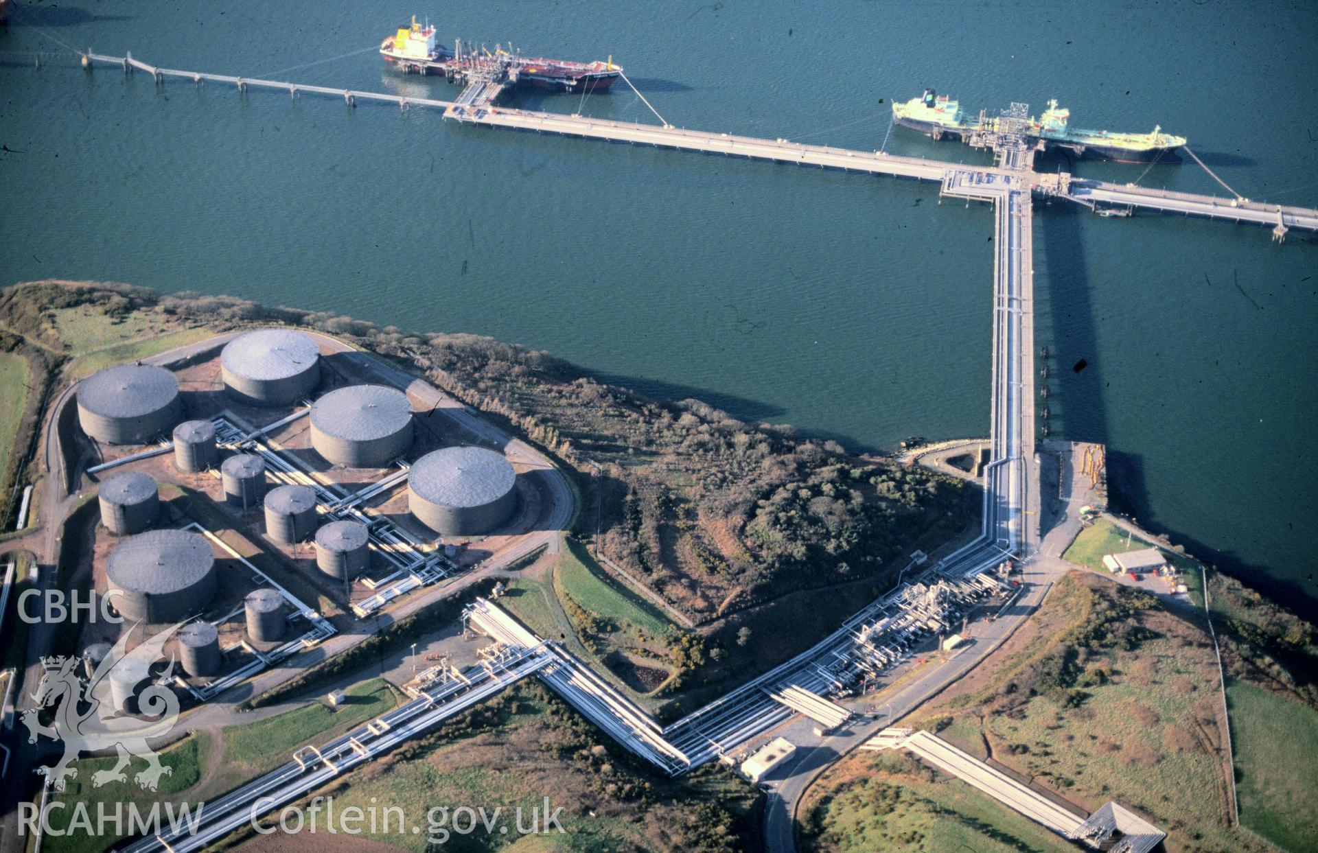Slide of RCAHMW colour oblique aerial photograph of Angle Bay oil terminal, Popton, taken by C.R. Musson, 24/3/1991.