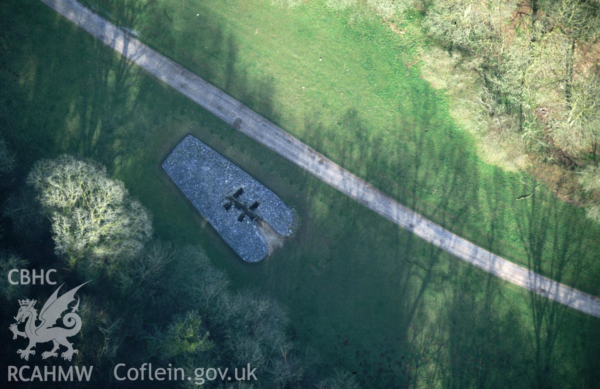 RCAHMW colour slide oblique aerial photograph of Parc Le Breos Burial Chamber, Ilston, taken by C.R. Musson, 29/03/94