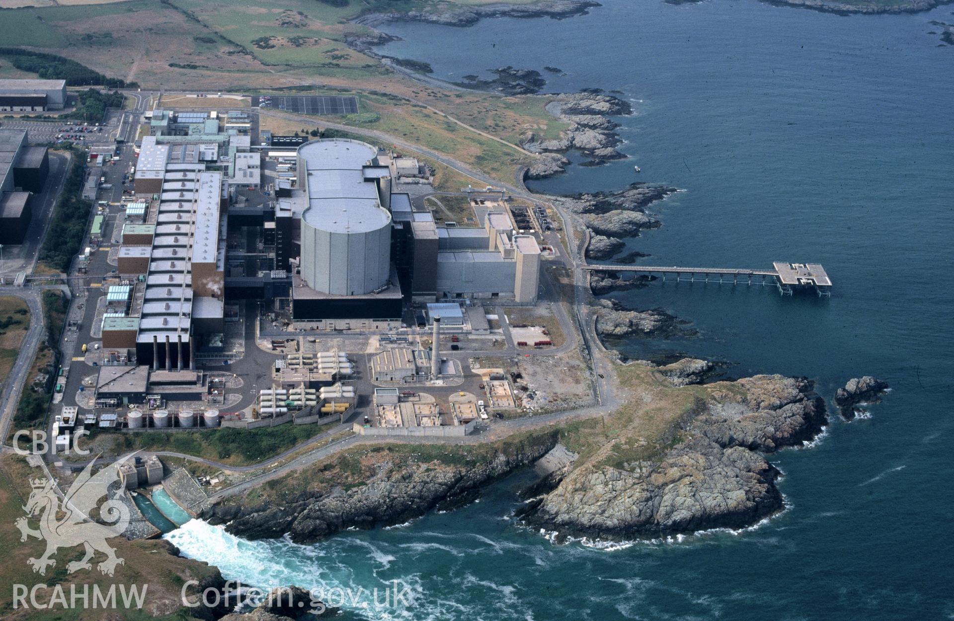 Slide of RCAHMW colour oblique aerial photograph of Wylfa Nuclear Power Station, taken by C.R. Musson, 9/7/1995.