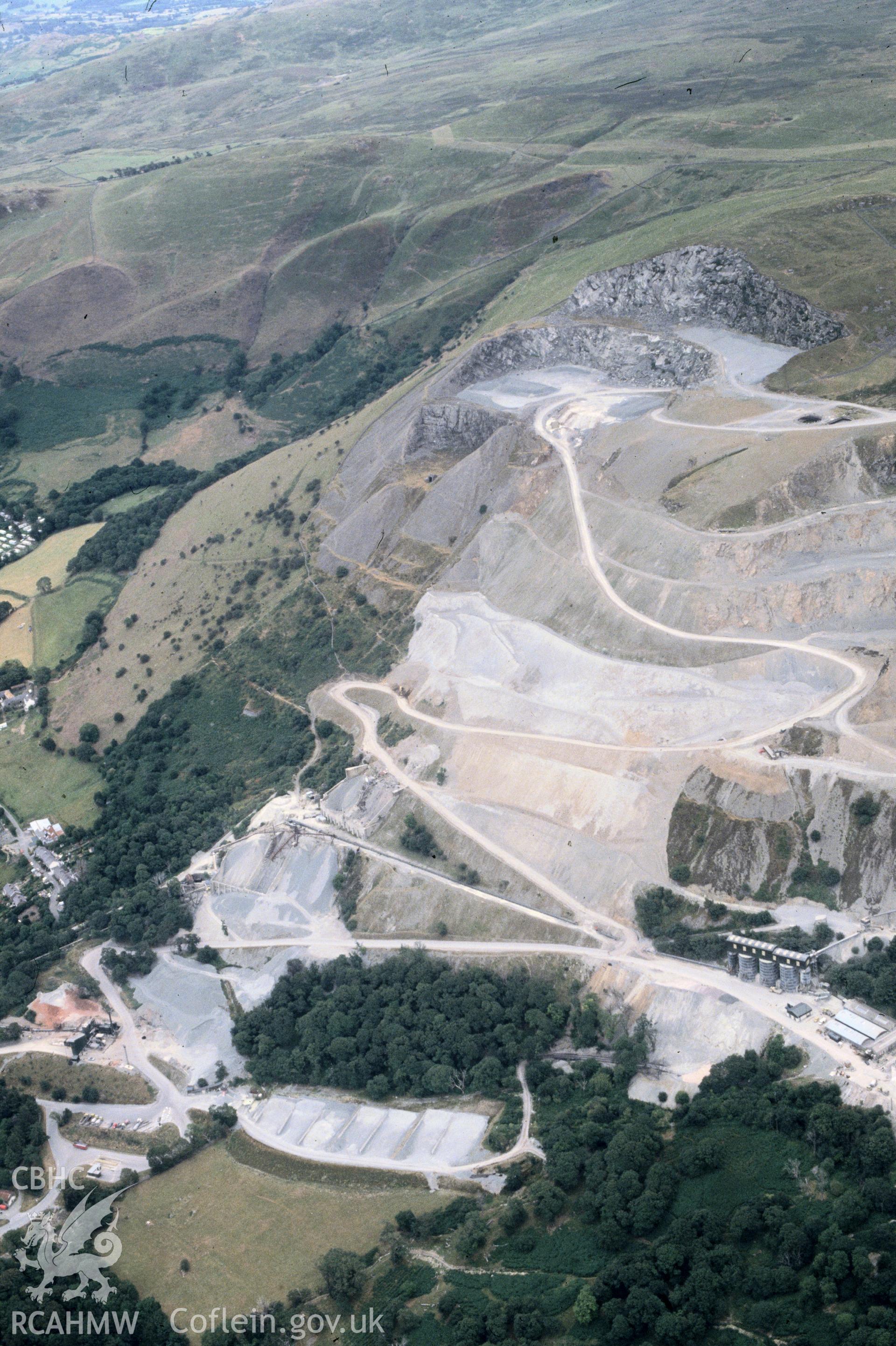 Slide of RCAHMW colour oblique aerial photograph of Penmaenmawr Stone Quarry, taken by C.R. Musson, 5/8/1990.