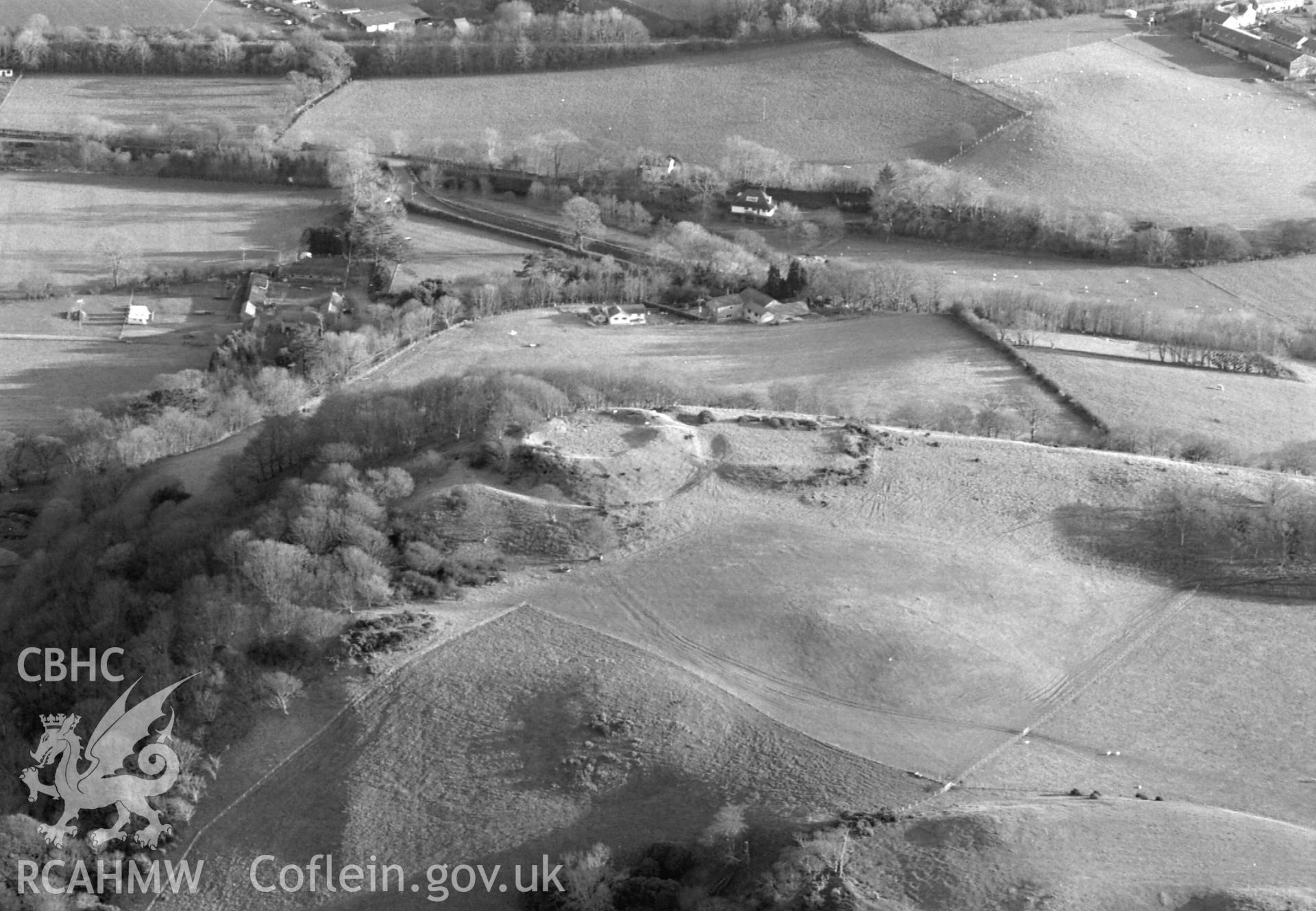 RCAHMW Black and white oblique aerial photograph of Tan-y-Castell earthen castle (Old Aberystwyth Castle), taken on 04/12/1998 by Toby Driver.