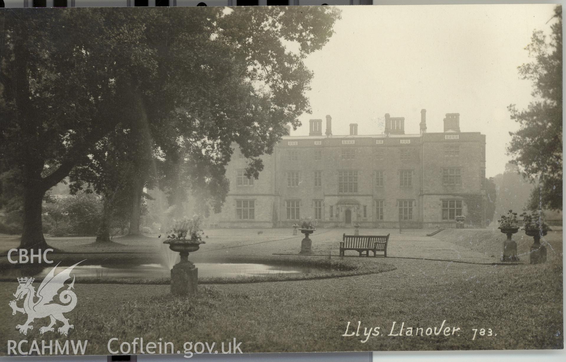 Digitised postcard image of Llanover House, Llanover, with fountain and garden urns. Produced by Parks and Gardens Data Services, from an original item in the Peter Davis Collection at Parks and Gardens UK. We hold only web-resolution images of this collection, suitable for viewing on screen and for research purposes only. We do not hold the original images, or publication quality scans.