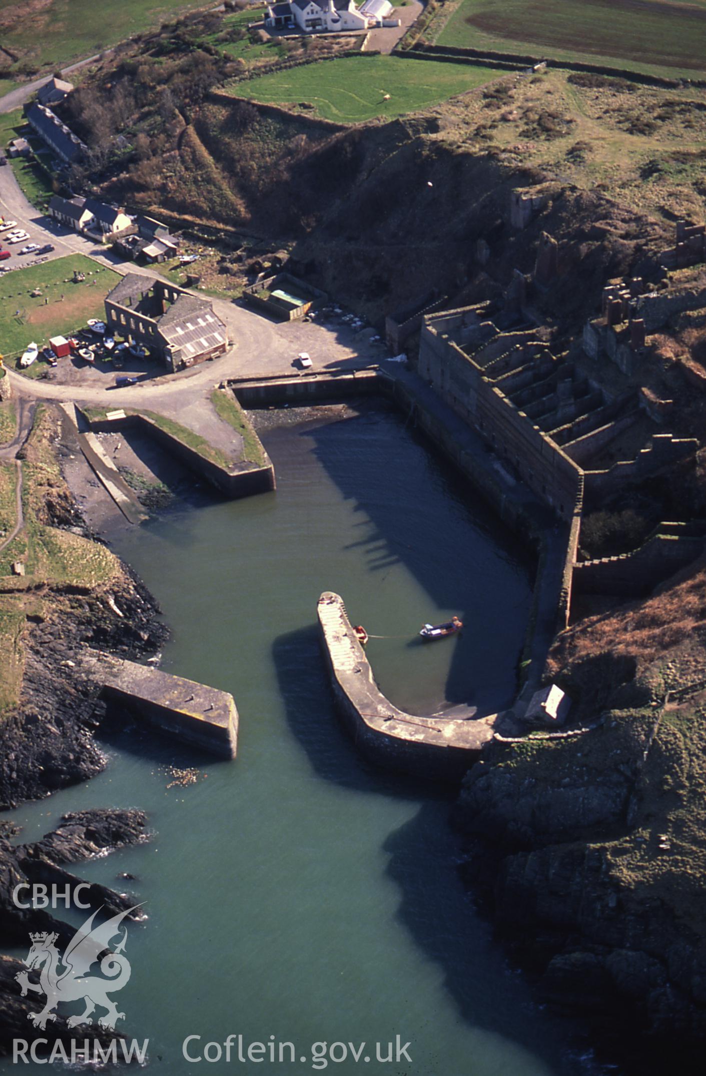 RCAHMW colour slide oblique aerial photograph of Porthgain Harbour and Brickworks, Llanrhian, taken on 24/03/1991 by CR Musson