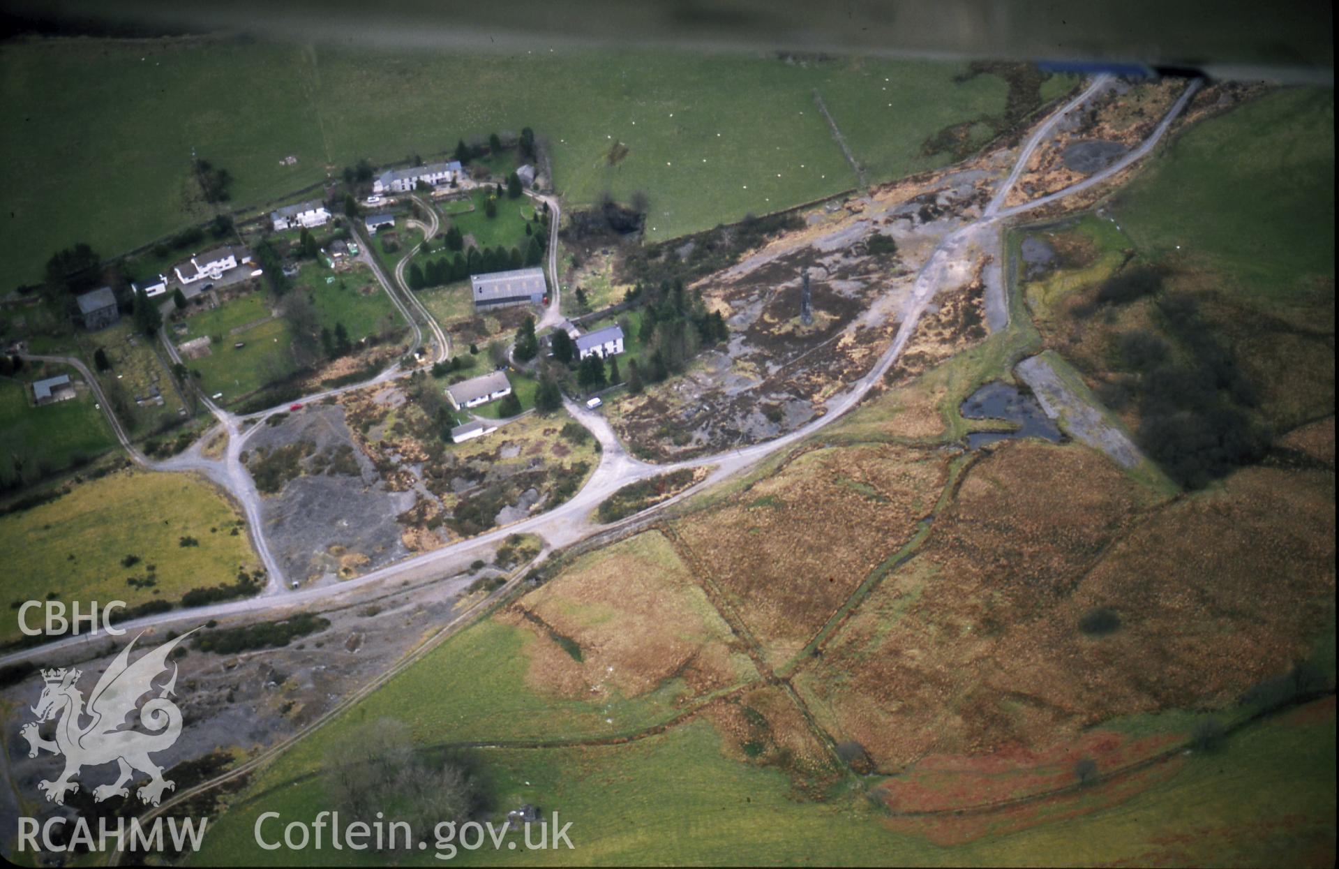 RCAHMW colour slide oblique aerial photograph of Cwmsymlog Lead Mine, Trefeurig, taken on 19/03/1999 by Toby Driver