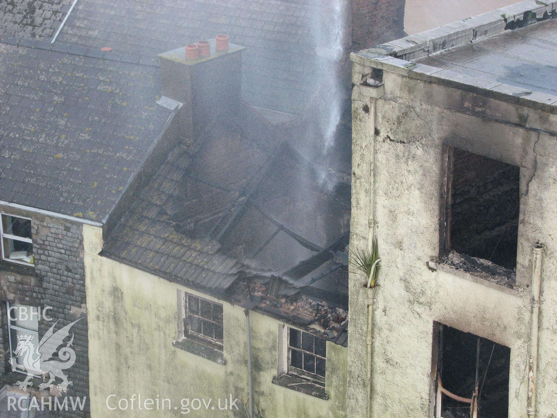 Colour digital photograph showing the damage caused by fire to the exterior of the Royal Gatehouse Hotel.