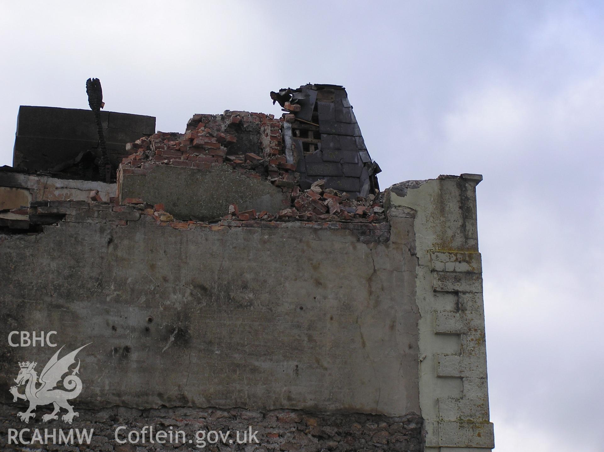 Colour digital photograph showing the wreckage of the Royal Gatehouse Hotel.