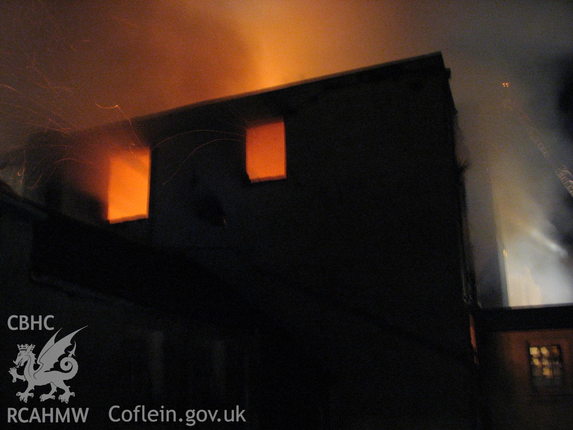 Colour digital photograph of The Royal Gatehouse Hotel, on fire.