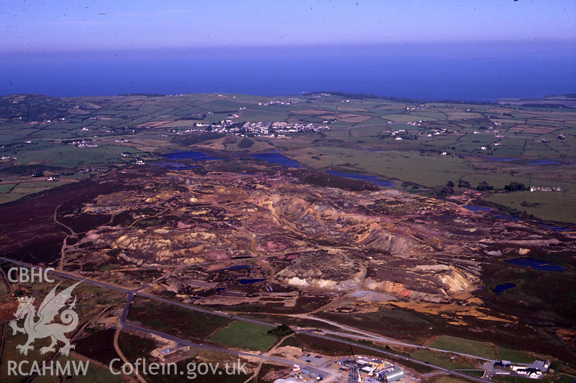 Slide of RCAHMW colour oblique aerial photograph of Parys Mountain Copper Mines, Amlwch, taken by C.R. Musson, 11/7/1989.