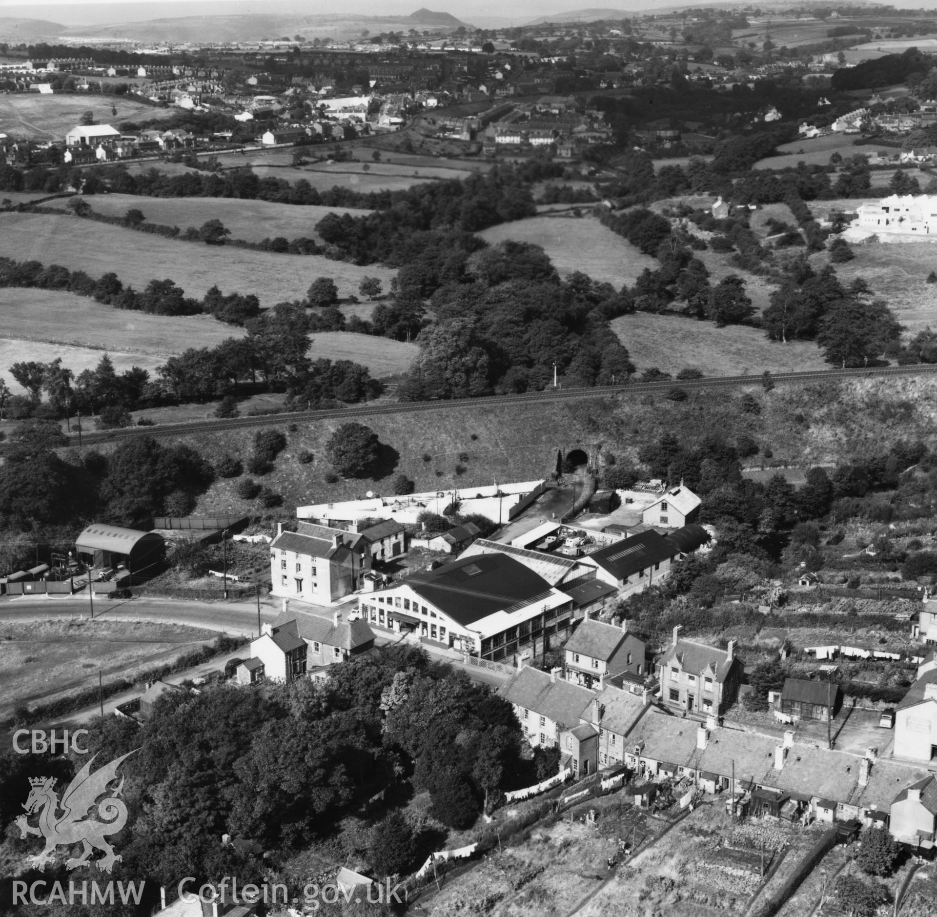 View of Gibbs Brothers garage at Pontllanfraith also showing people viewing aeroplane and washing drying in back gardens. Oblique aerial photograph, 5?" cut roll film.
