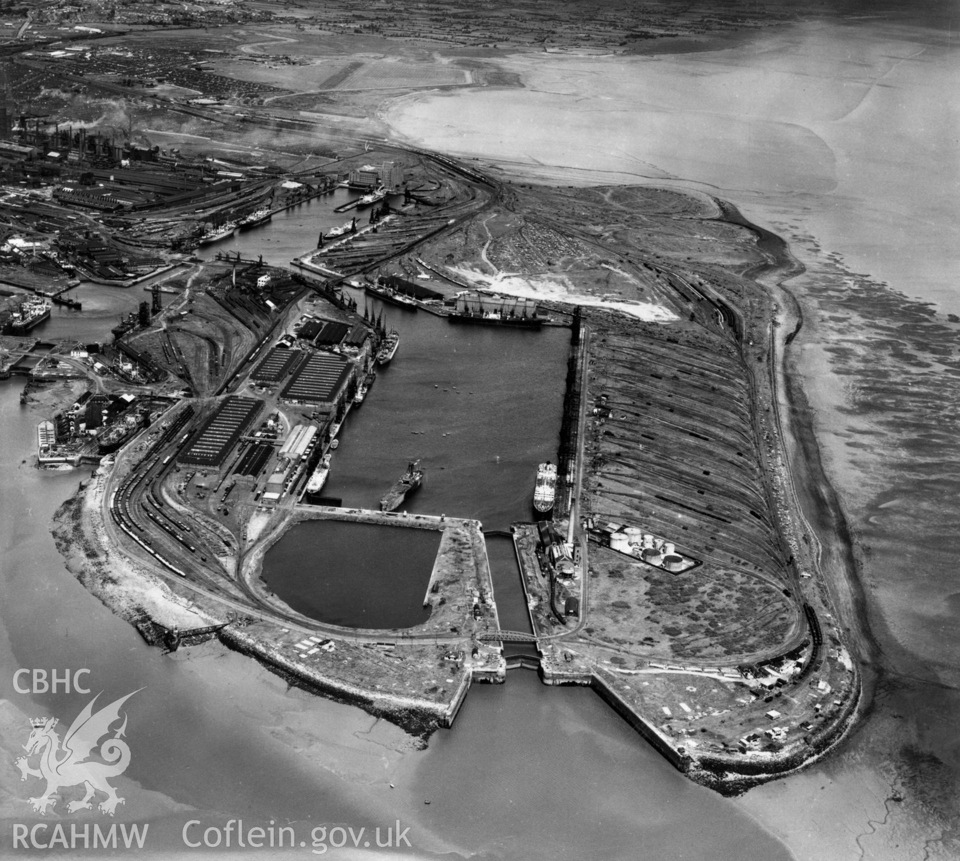 View of Cardiff docks from the south with Queen Alexandra dock in the foreground. Oblique aerial photograph, 5?" cut roll film.
