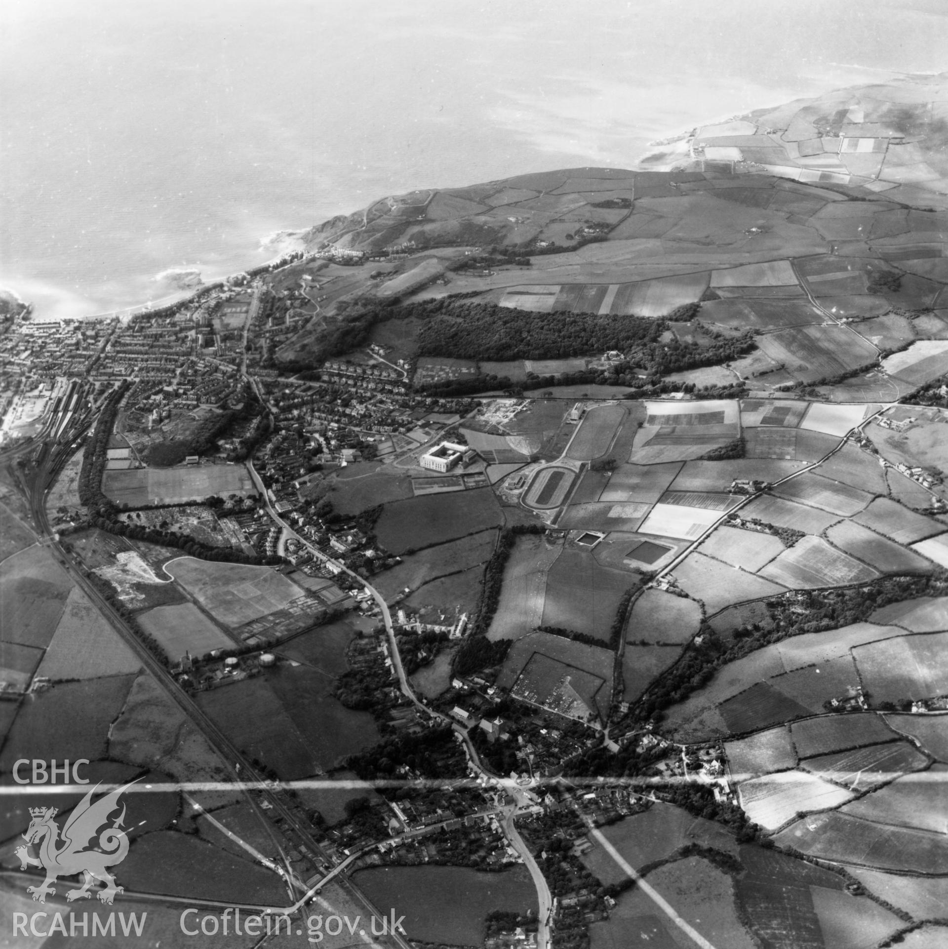 Distant view of Aberystwyth and Llanbadarn Fawr, commissioned by J.E. Nichols. Oblique aerial photograph, 5?" cut roll film.