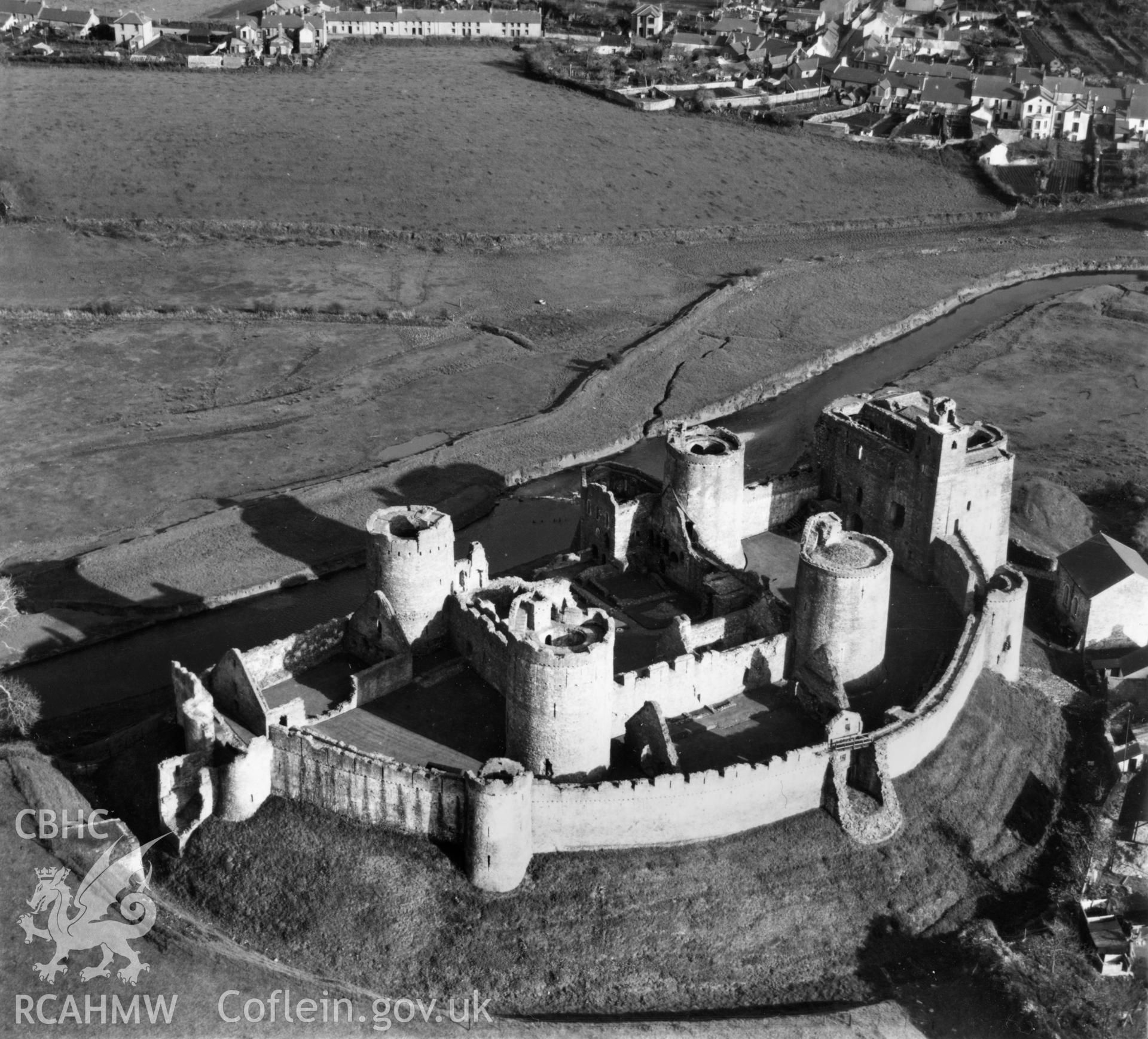 View of Kidwelly castle. Oblique aerial photograph, 5?" cut roll film.