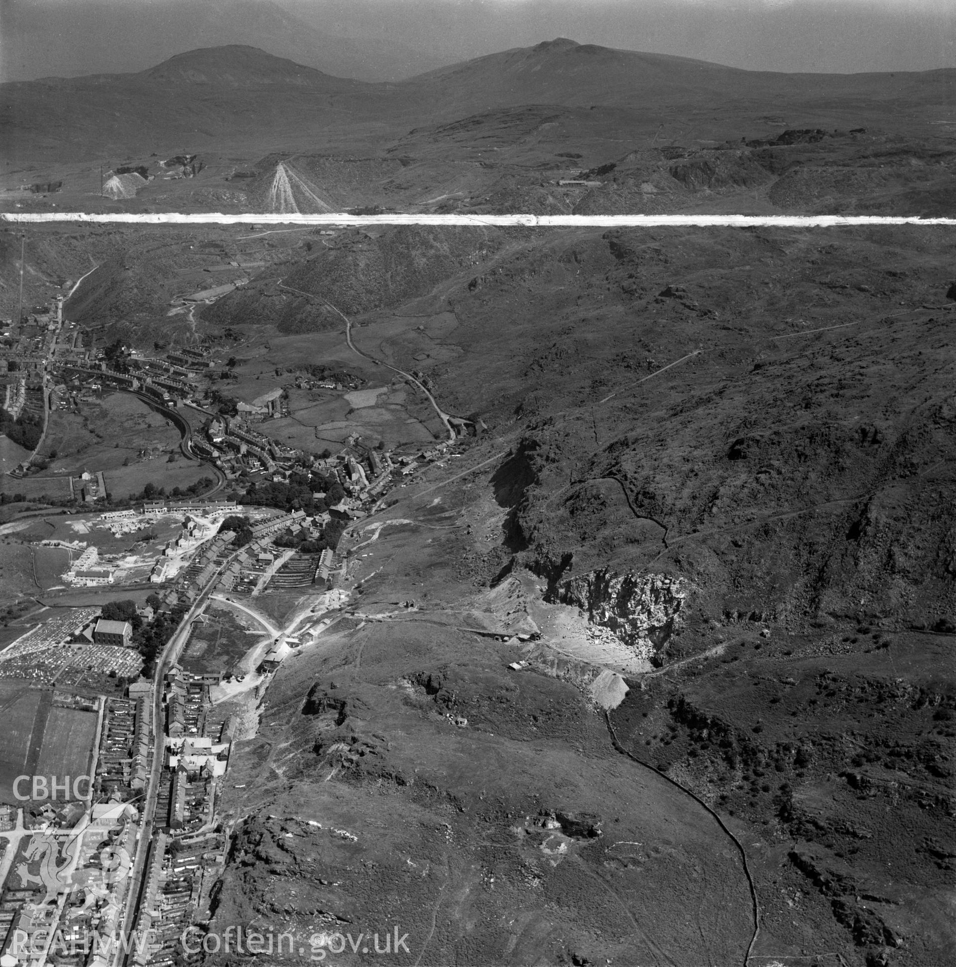 View of Blaenau Ffestiniog showing the construction of the Penygwndwn Estate, commissioned by Cawood Wharton & Co. Ltd.. Oblique aerial photograph, 5?" cut roll film.