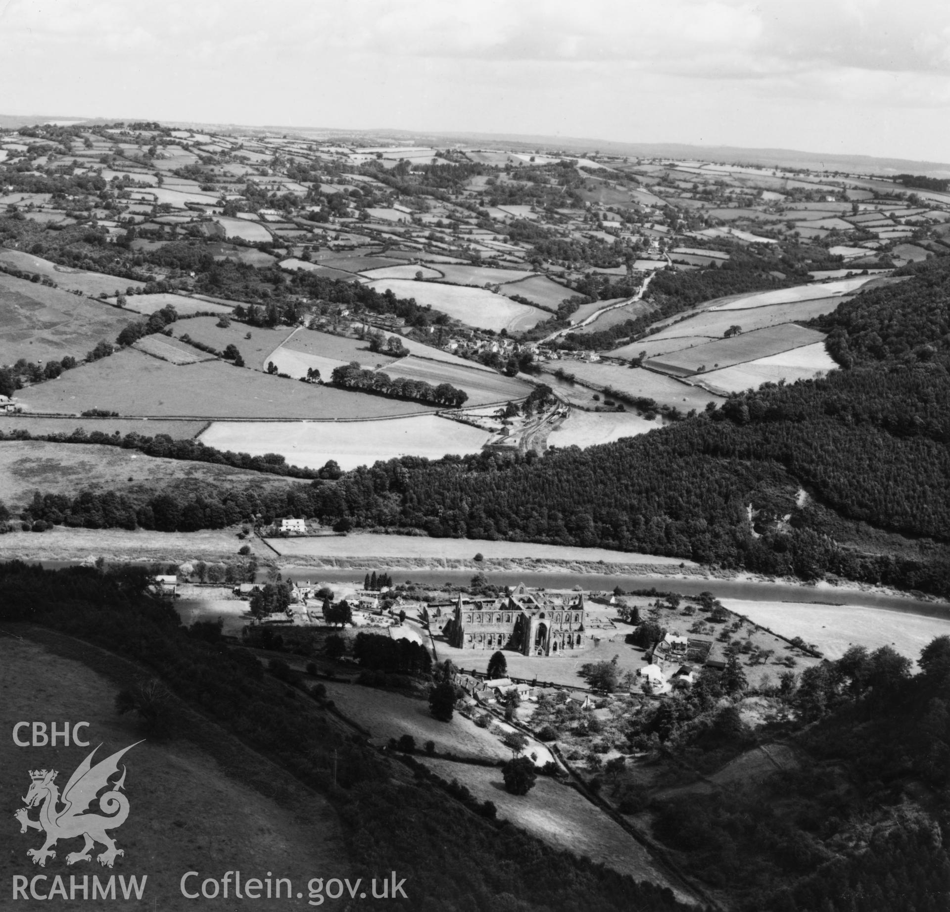 View of Tintern Abbey and the Wye valley. Oblique aerial photograph, 5?" cut roll film.