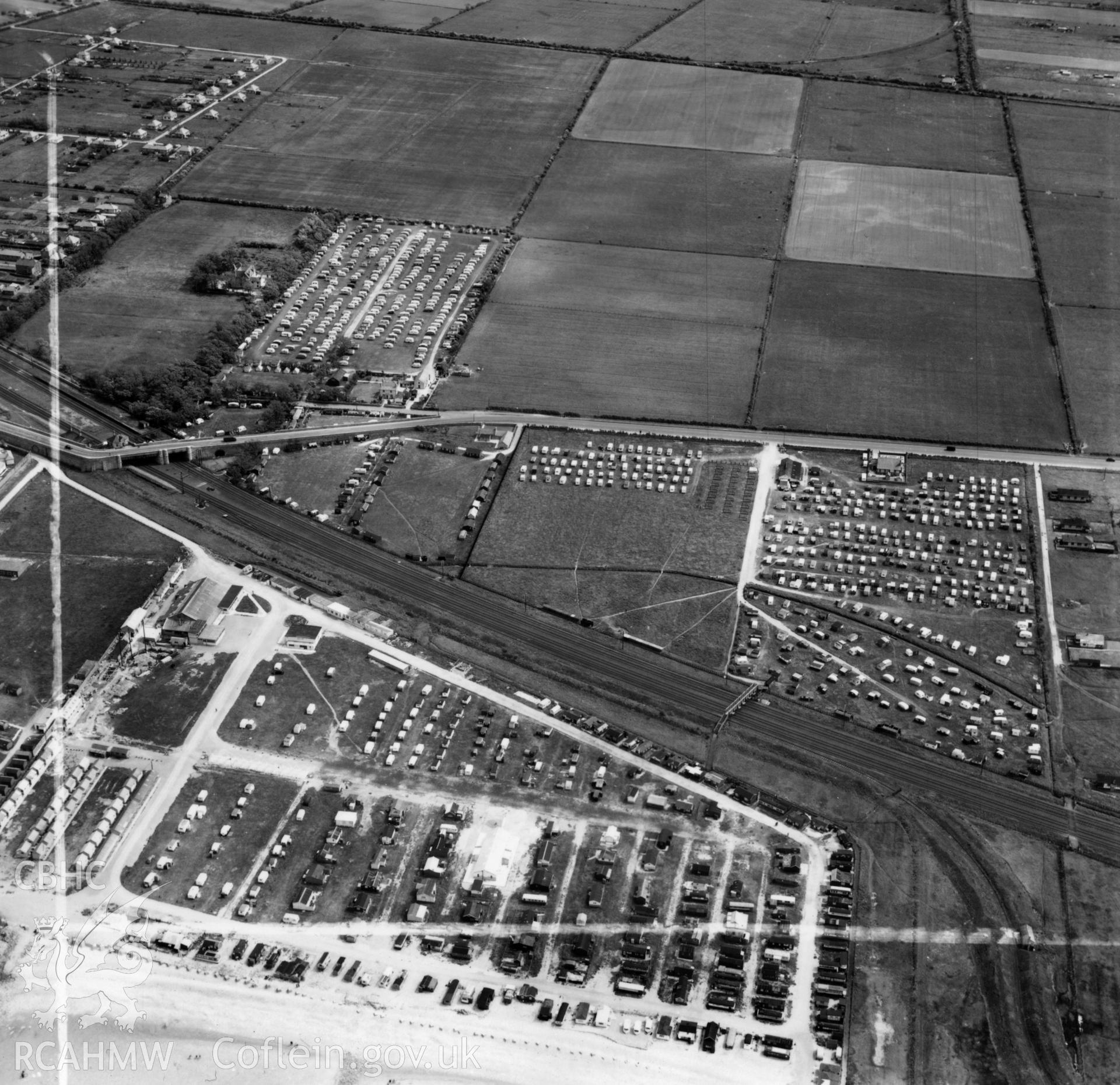 View of Winkups Holiday Camp, Foryd, commissioned by W.H.Smith & Son Ltd.. Oblique aerial photograph, 5?" cut roll film.