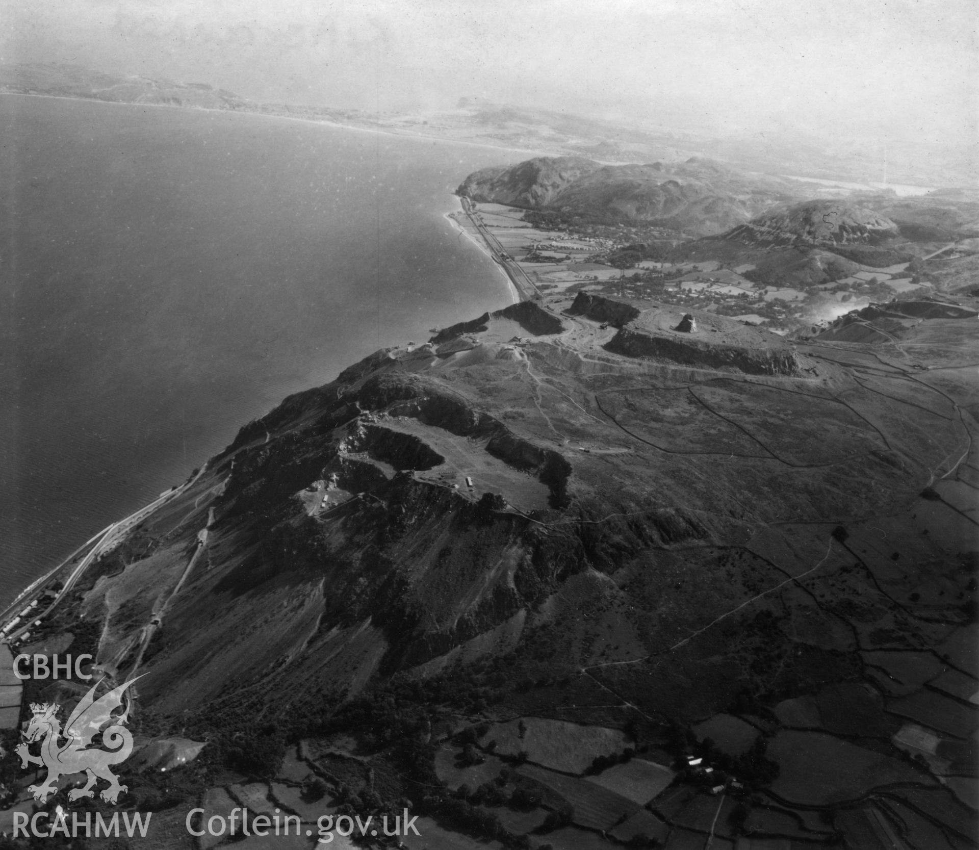 View of Penmaenmawr and Welsh Granite Co. Ltd. Quarries at Penmaenmawr. Oblique aerial photograph, 5?" cut roll film.