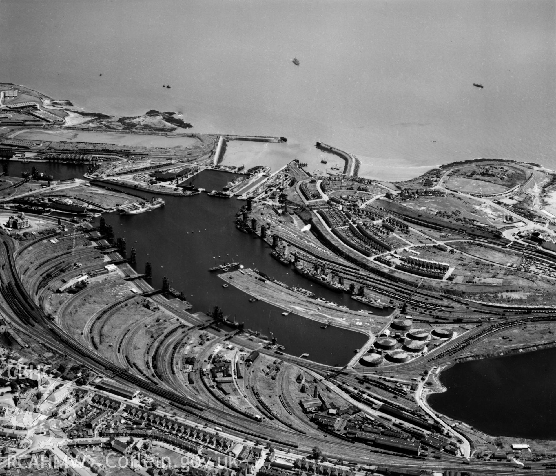General view of Barry docks with view of signal station and ex-military camp at Barry Island. Oblique aerial photograph, 5?" cut roll film.
