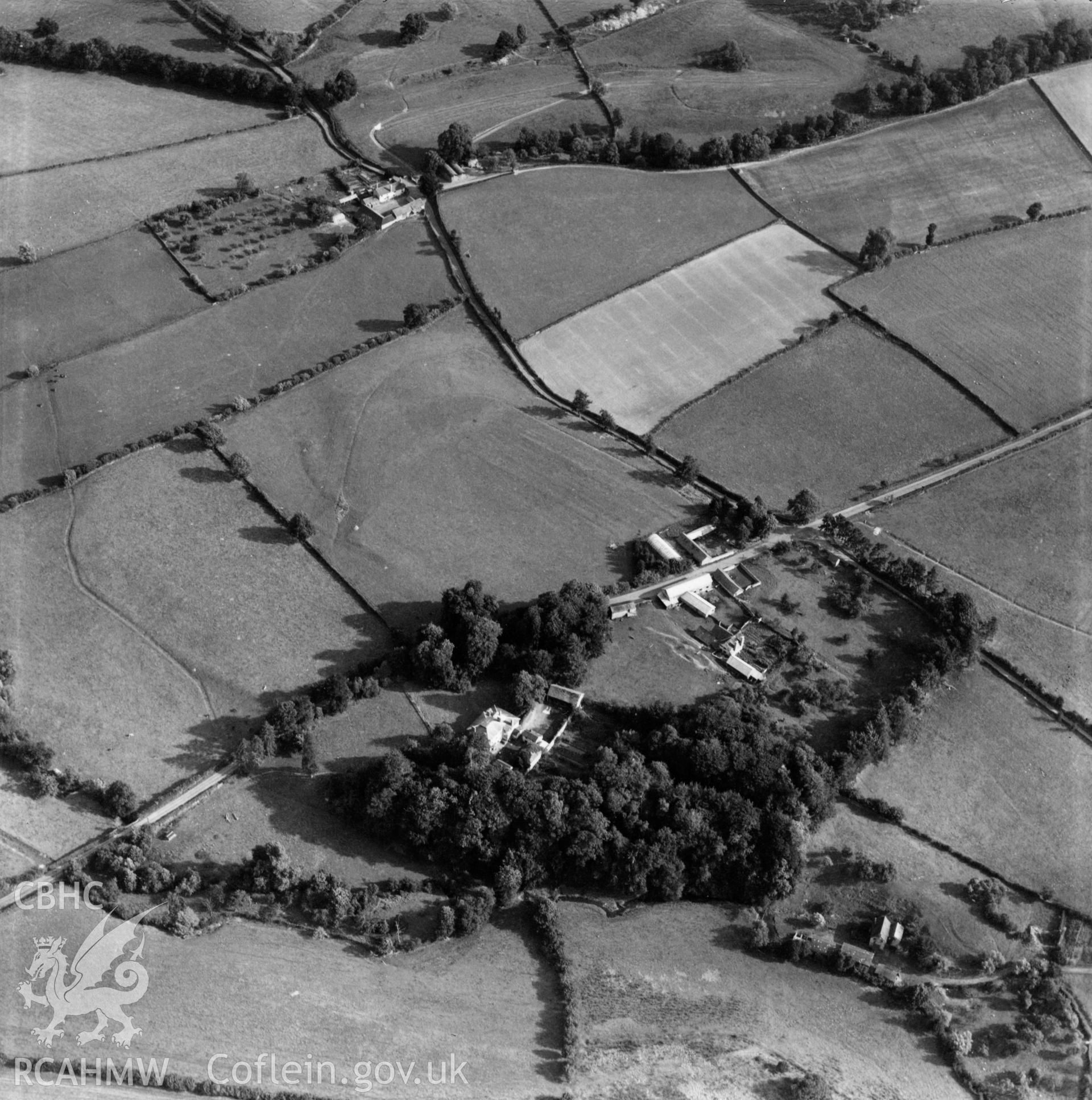 View of Lugg valley showing The Grove, Maes Treylow, and Yew Tree farm in the distance. Oblique aerial photograph, 5?" cut roll film.