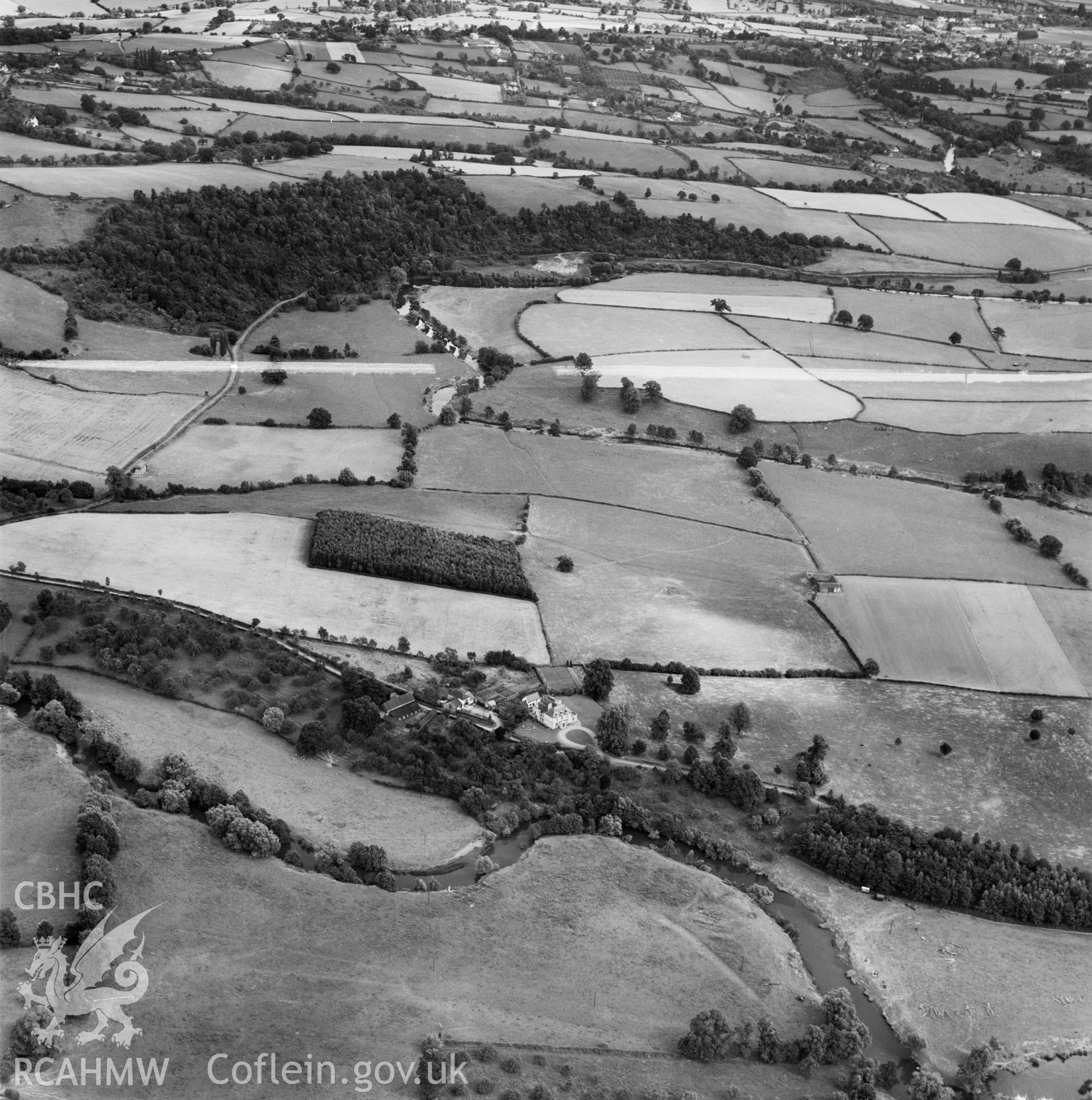 Distant view of Rockfield Park and grounds, commissioned by D.H.Lloyd Esq., Bedford Cottage, Bury Road, Newmarket. Oblique aerial photograph, 5?" cut roll film.