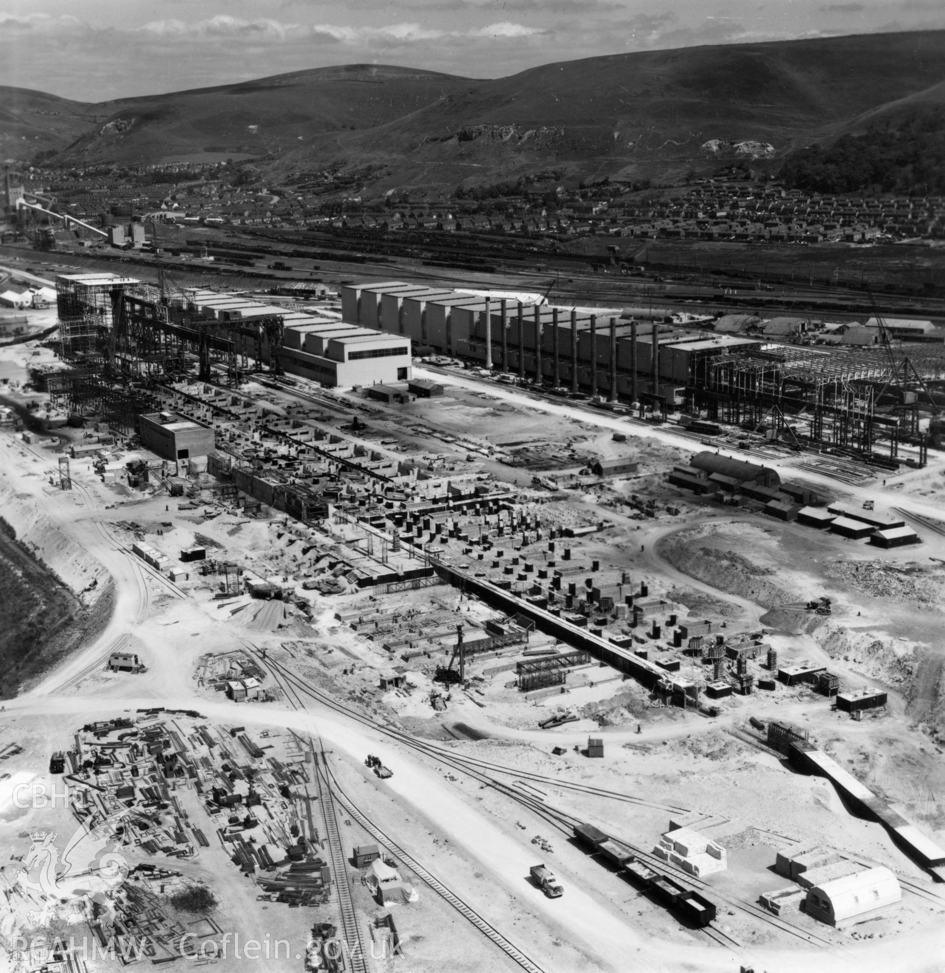 General view of Abbey Steelworks under construction, with Port Talbot in the distance. Oblique aerial photograph, 5?" cut roll film.