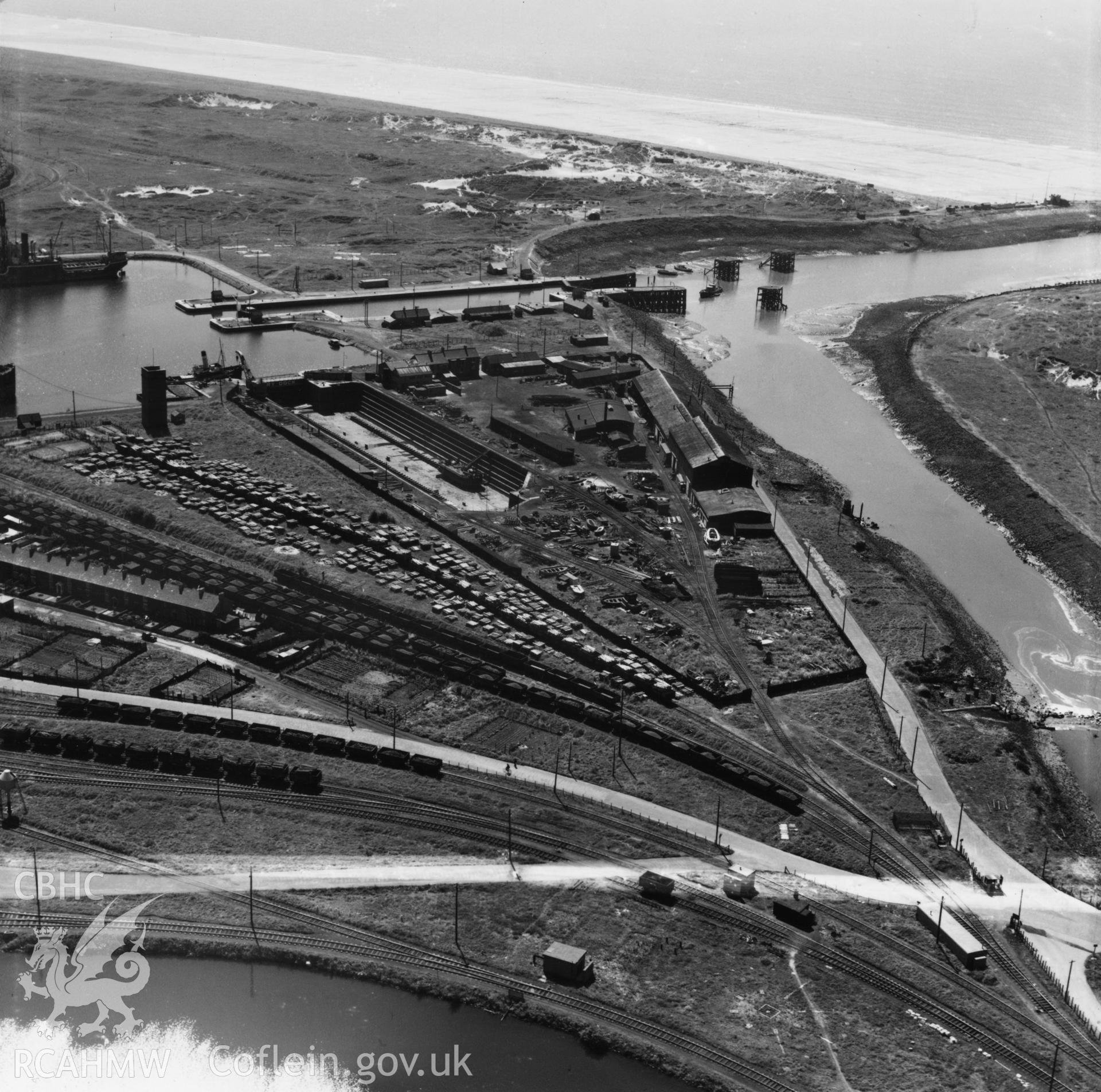 View of dry, new and old docks and entrance channel, Port Talbot. Oblique aerial photograph, 5?" cut roll film.