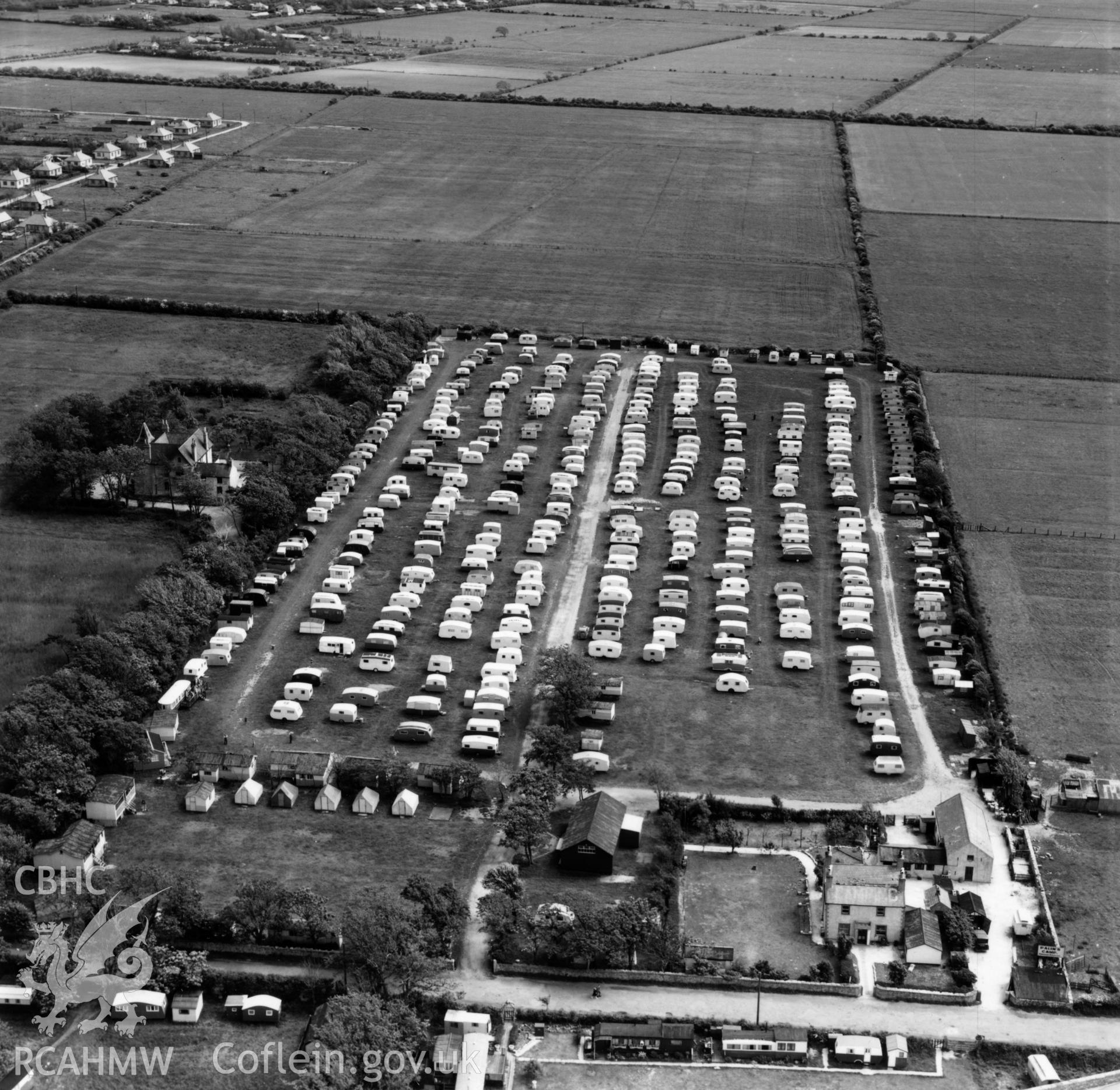 View of Palin's Holiday Camp, Foryd, commissioned by W.H.Smith & Son Ltd.. Oblique aerial photograph, 5?" cut roll film.