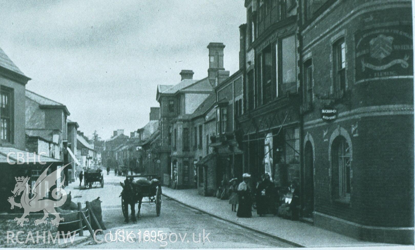 Digital copy of postcard showing street in Usk, dated 1895.