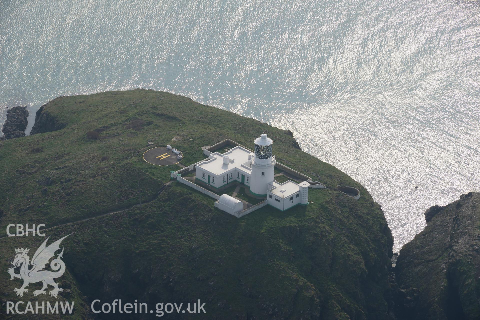 Aerial photography of Strumble Head lighthouse taken on 27th March 2017. Baseline aerial reconnaissance survey for the CHERISH Project. ? Crown: CHERISH PROJECT 2017. Produced with EU funds through the Ireland Wales Co-operation Programme 2014-2020. All material made freely available through the Open Government Licence.