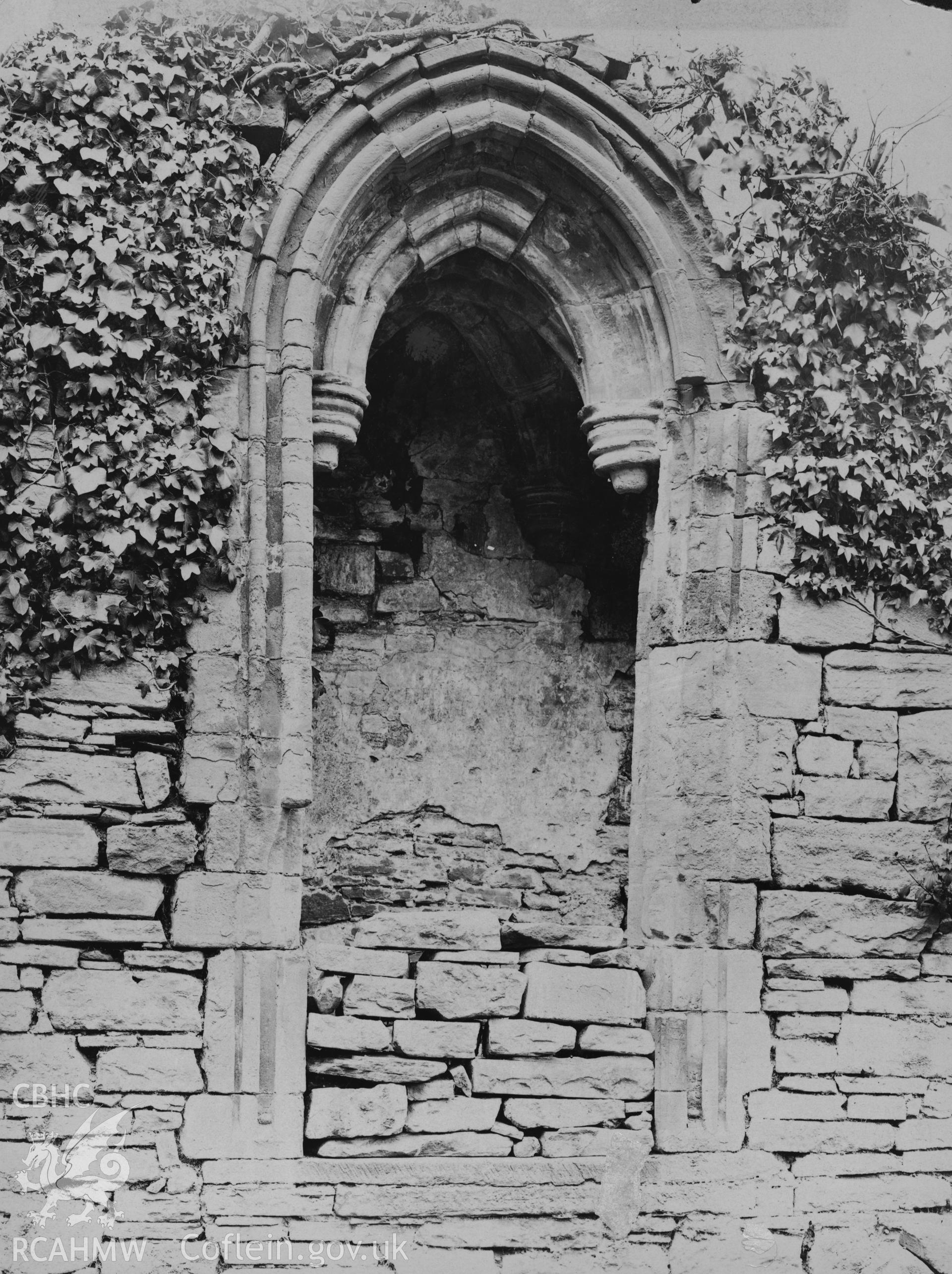Digital copy of an early National Buildings Record photograph showing the reader's pulpit at Tintern Abbey.