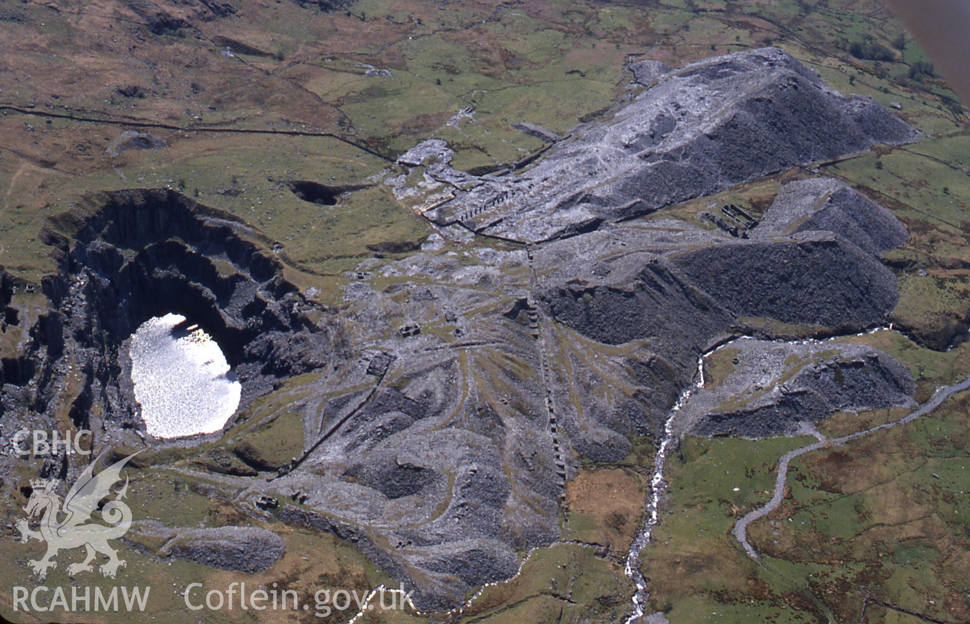Slide of RCAHMW colour oblique aerial photograph of Glanafon Quarry, Capel Garmon, taken by C.R. Musson, 2/5/1994.