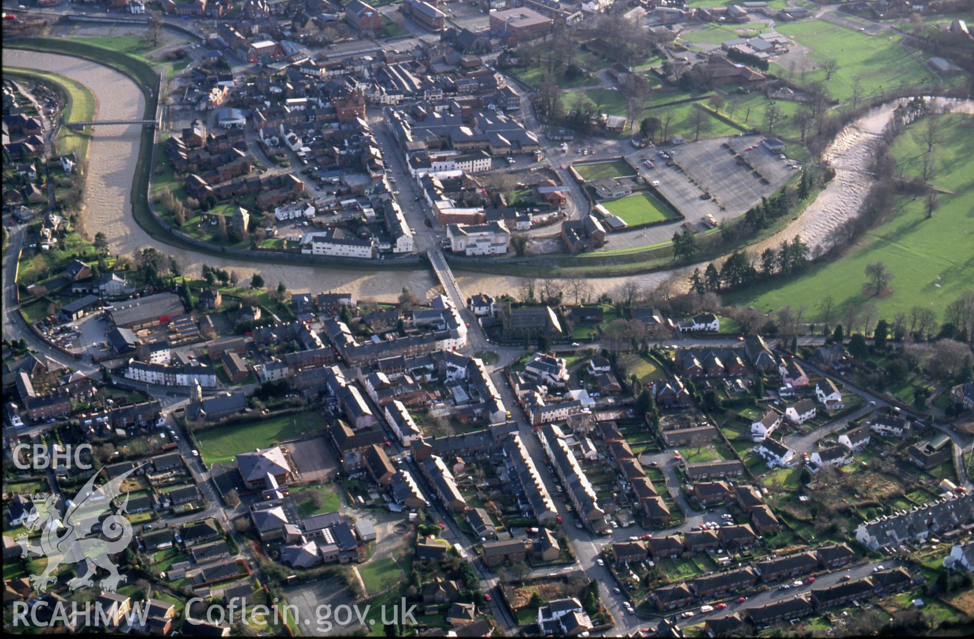 RCAHMW colour slide oblique aerial photograph of the town, Newtown and Llanllwchaiarn, taken by C.R. Musson, 23/01/94