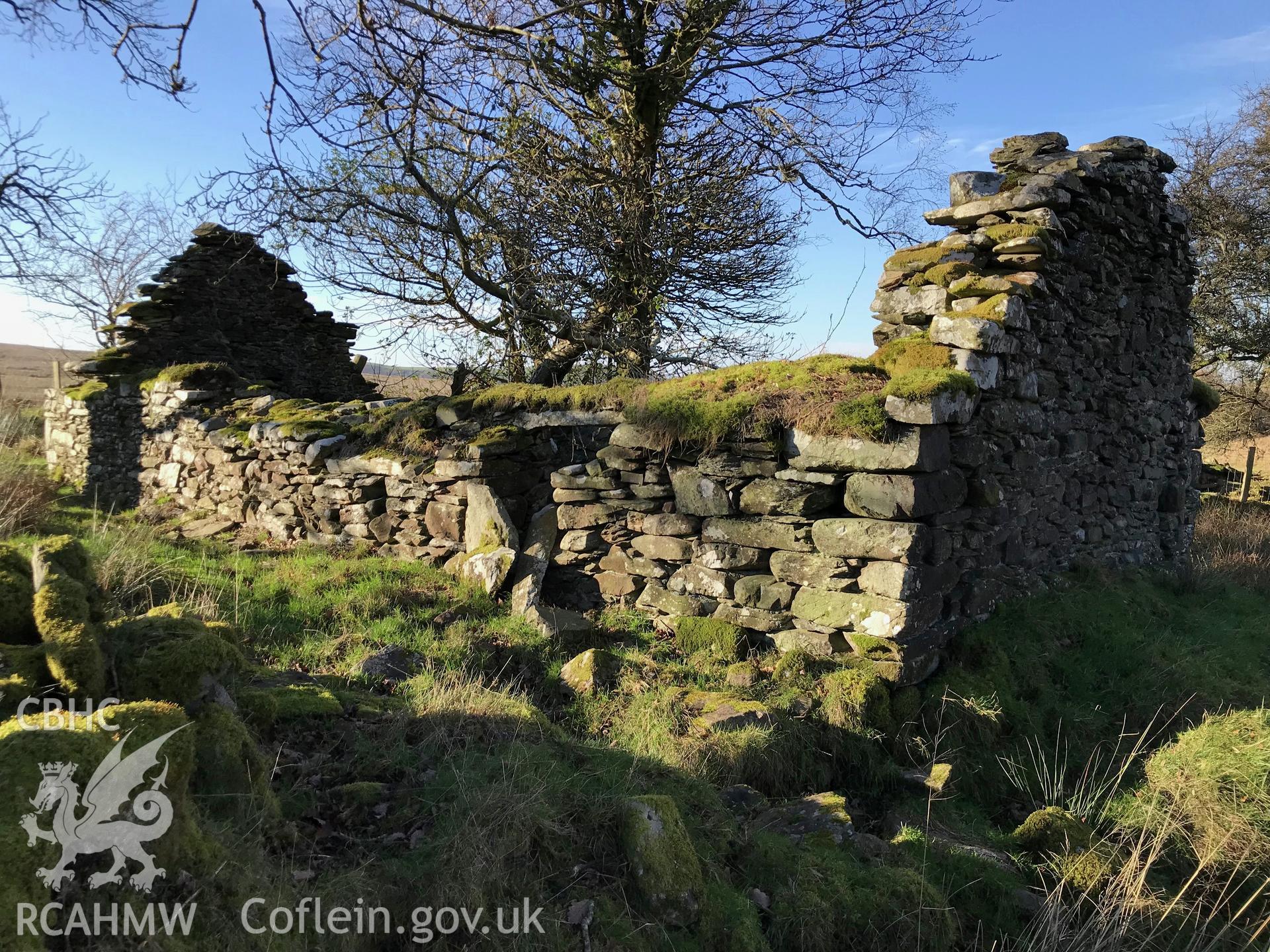 Exterior view of a stone cottage north west of the ruined Castell, which is south west of Bryneithinog farm, Ystrad Fflur. Colour photograph taken by Paul R. Davis on 18th November 2018.