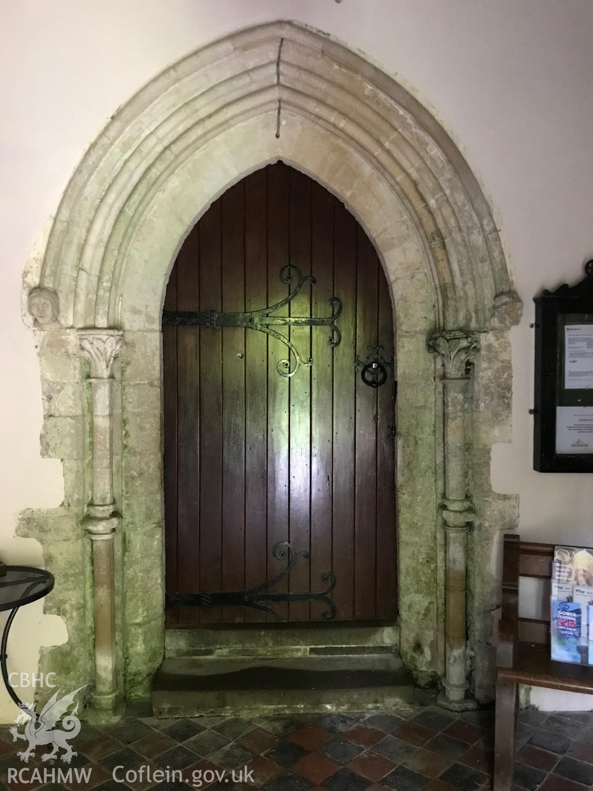Colour photo showing porch door at St. Cadog's Church, Cheriton, taken by Paul R. Davis, 19th May 2018.